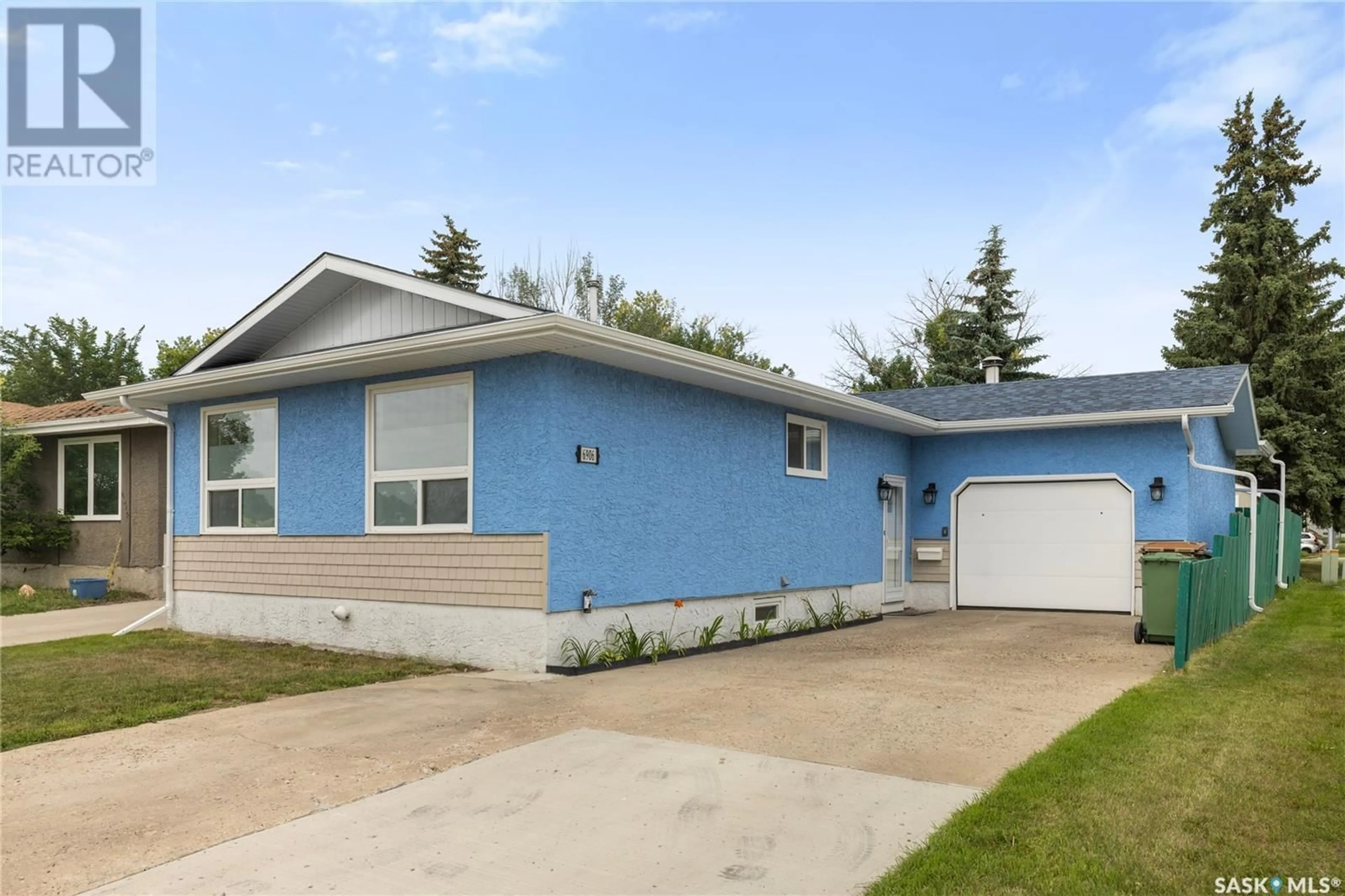 Home with vinyl exterior material, street for 6906 DALGLIESH DRIVE, Regina Saskatchewan S4X2M6