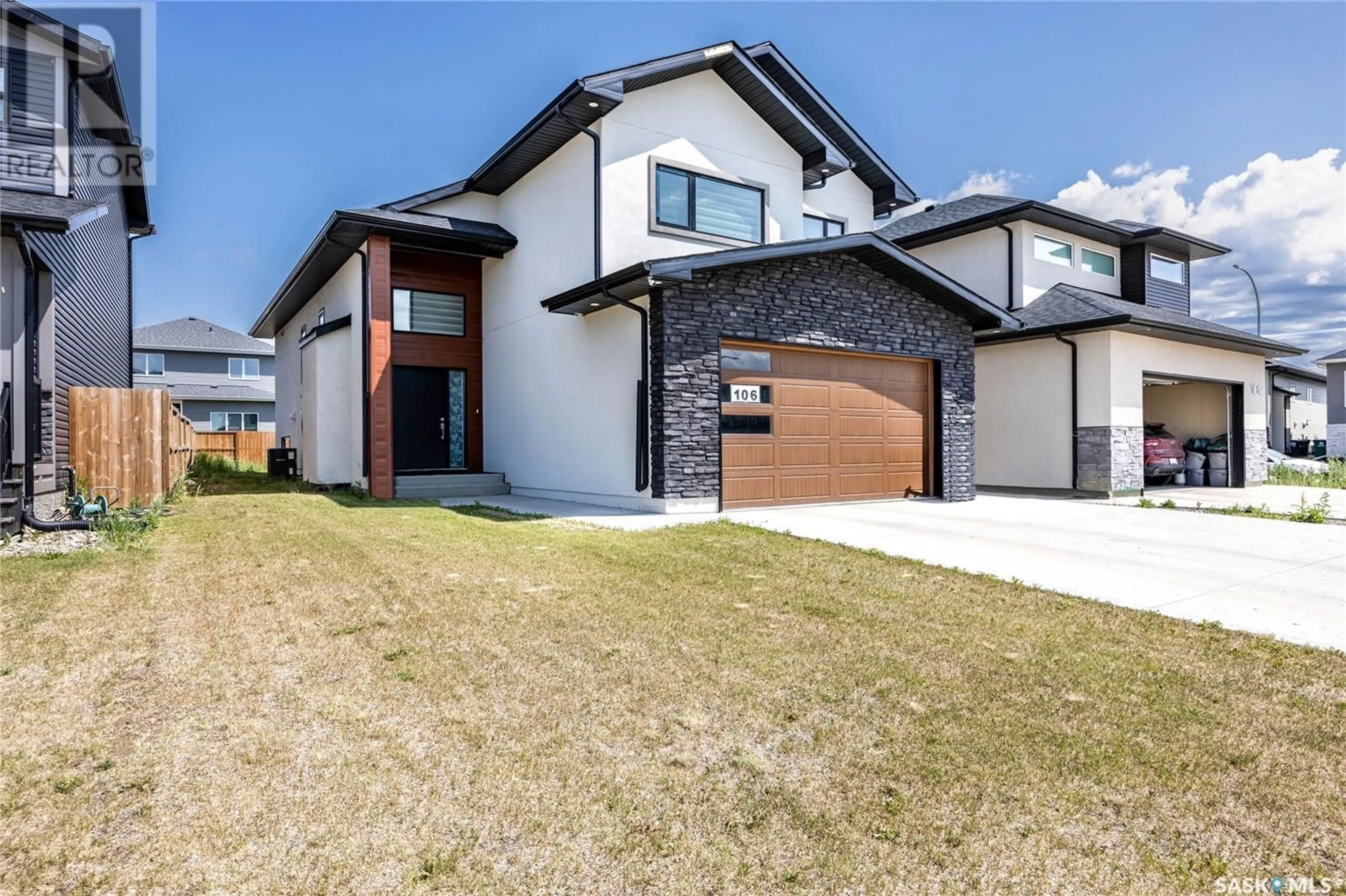 Home with brick exterior material, street for 106 KENASCHUK CRESCENT, Saskatoon Saskatchewan S7W0Y6