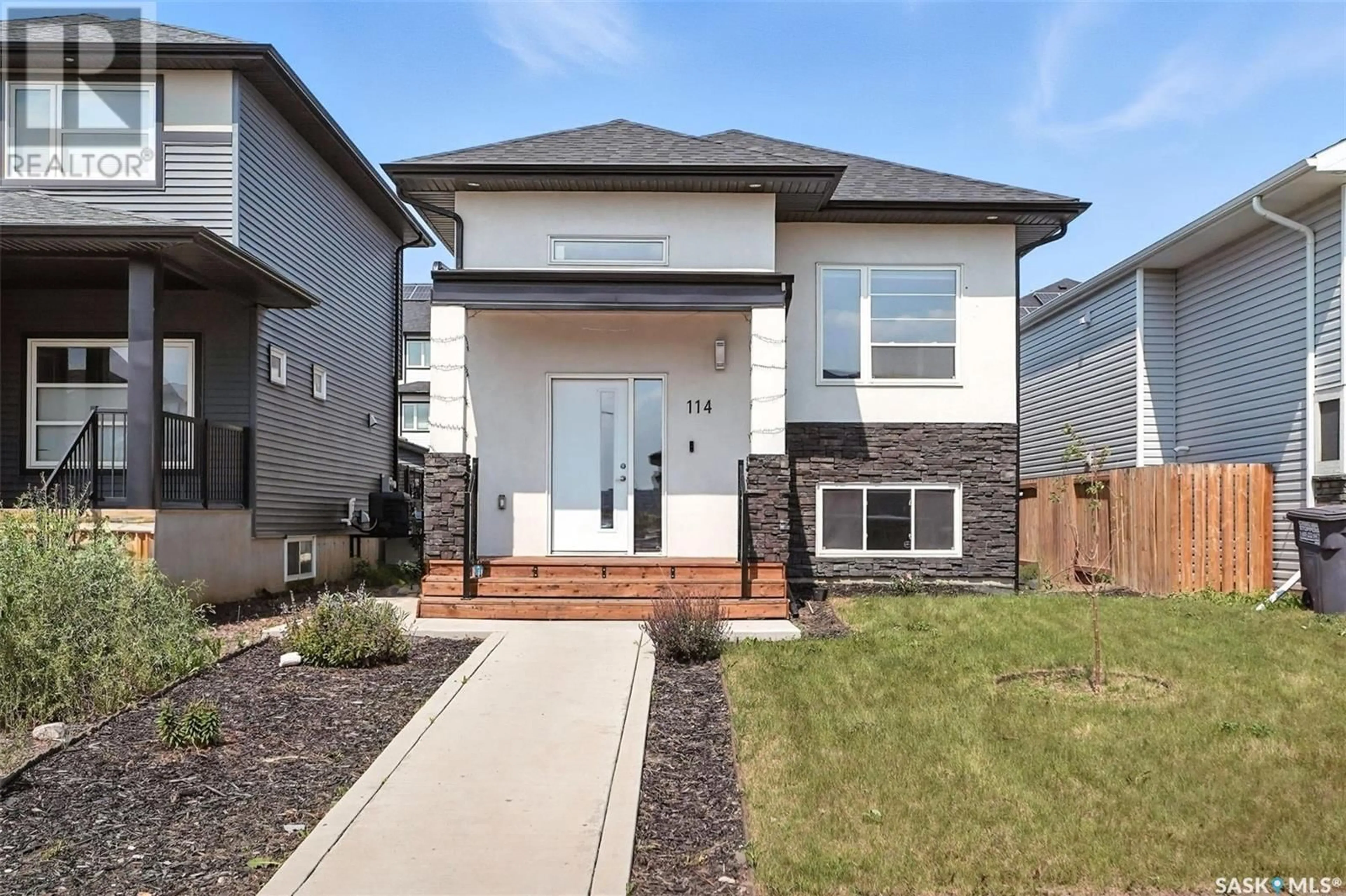 Home with brick exterior material, street for 114 BOLSTAD WAY, Saskatoon Saskatchewan S7W0Y1