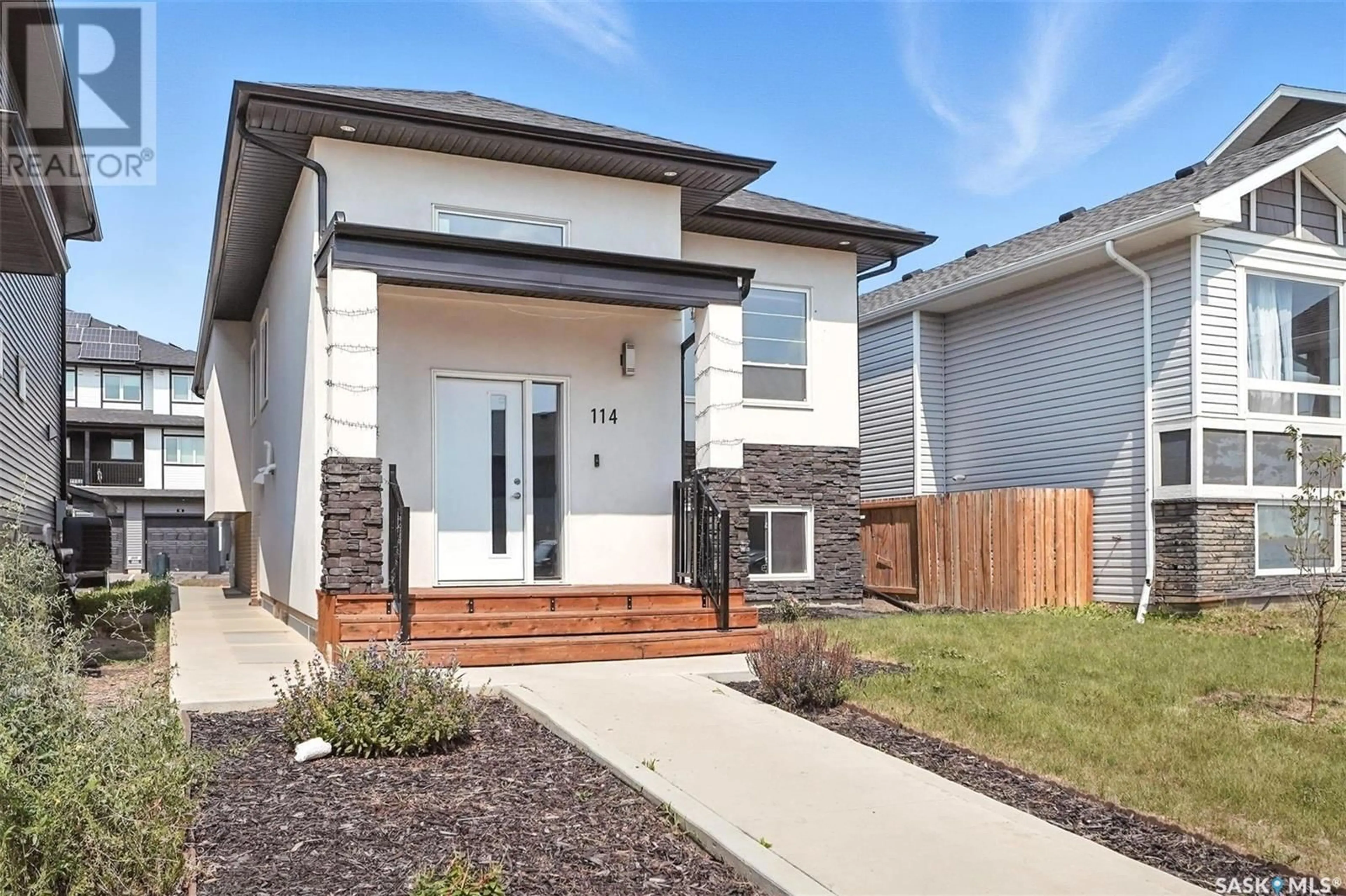Home with brick exterior material, street for 114 BOLSTAD WAY, Saskatoon Saskatchewan S7W0Y1