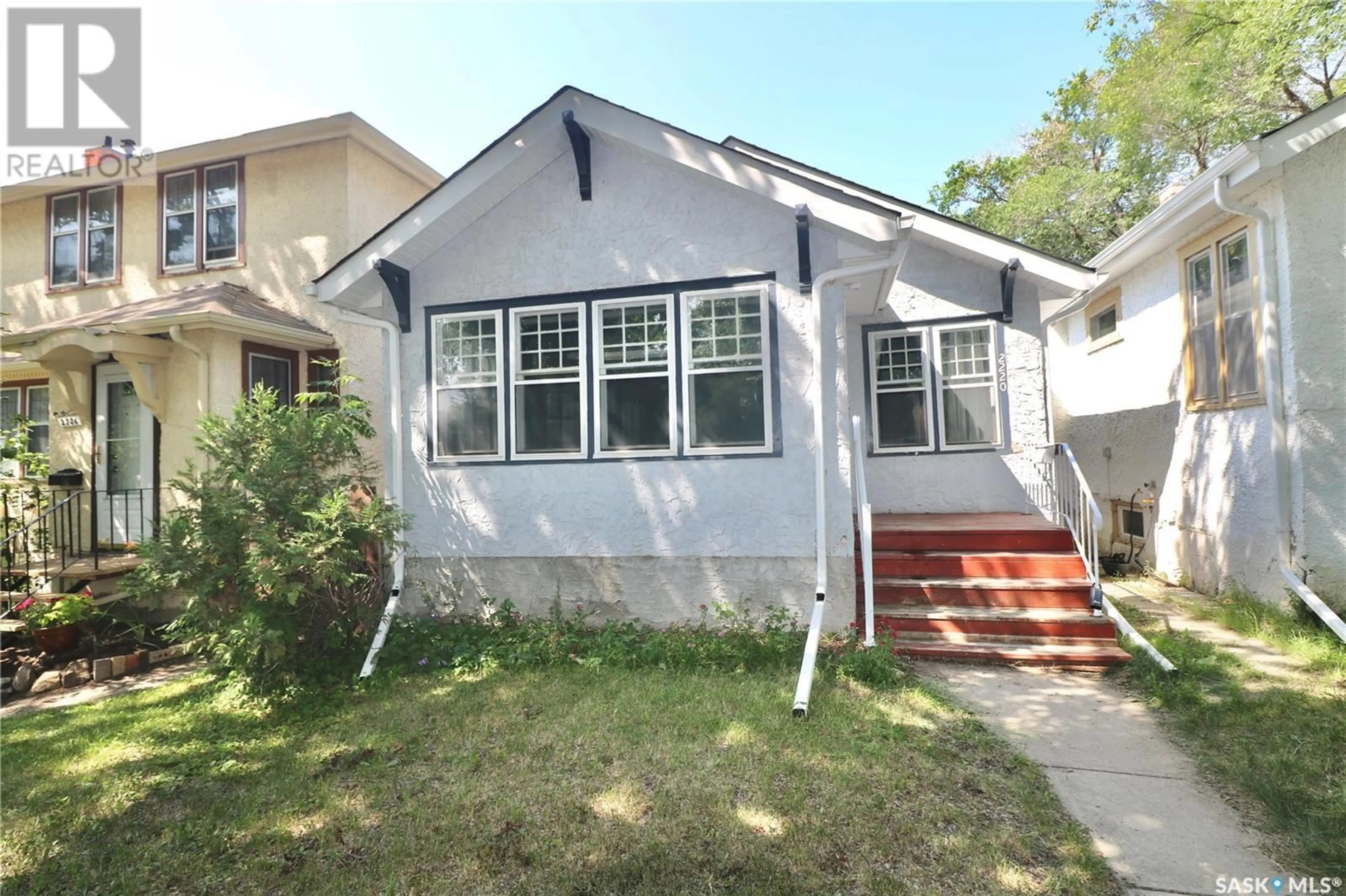 Home with vinyl exterior material, street for 2220 MCTAVISH STREET, Regina Saskatchewan S4T3X2