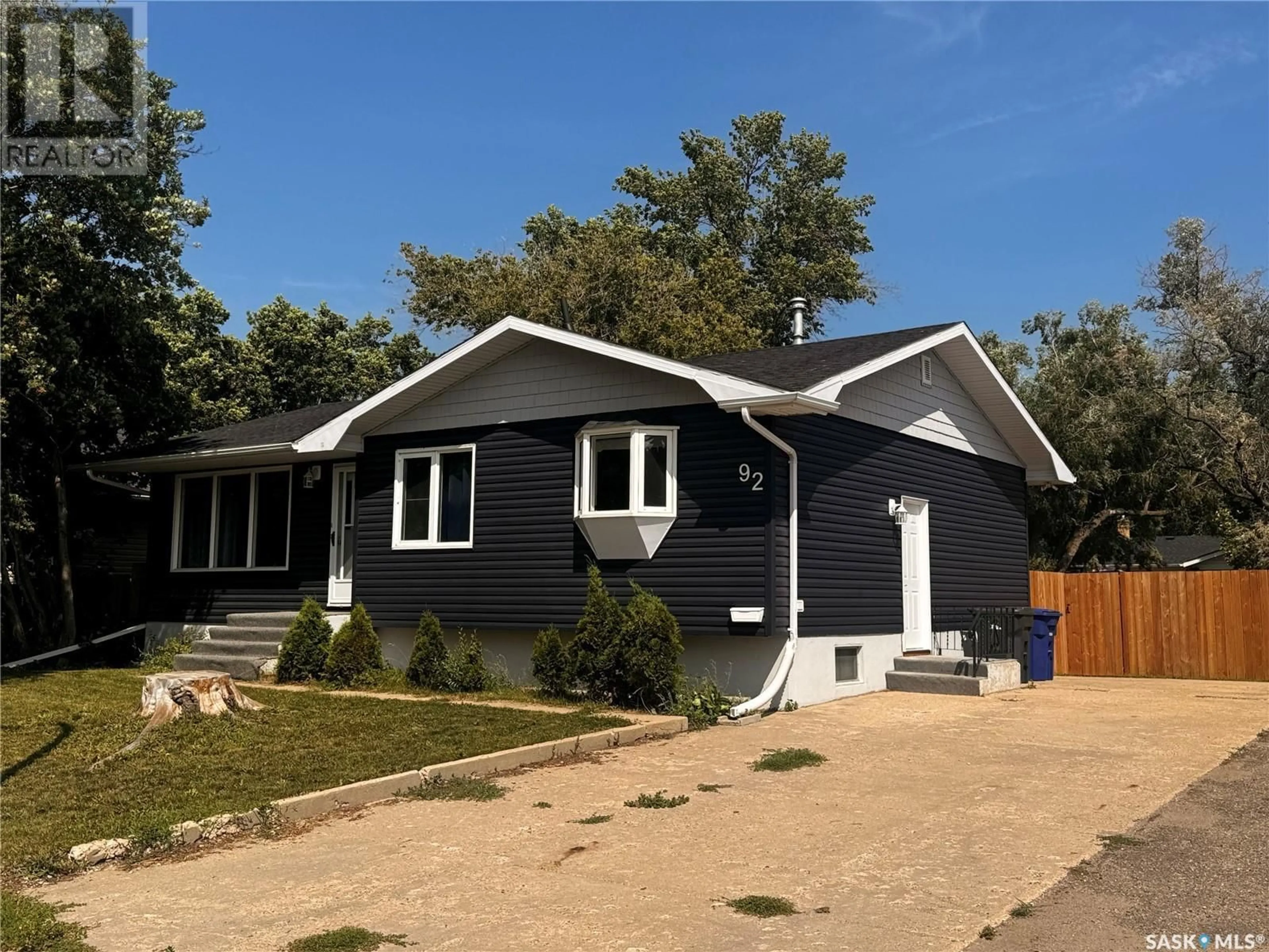 Home with vinyl exterior material, street for 92 SCOTT CRESCENT, Weyburn Saskatchewan S4H1T6