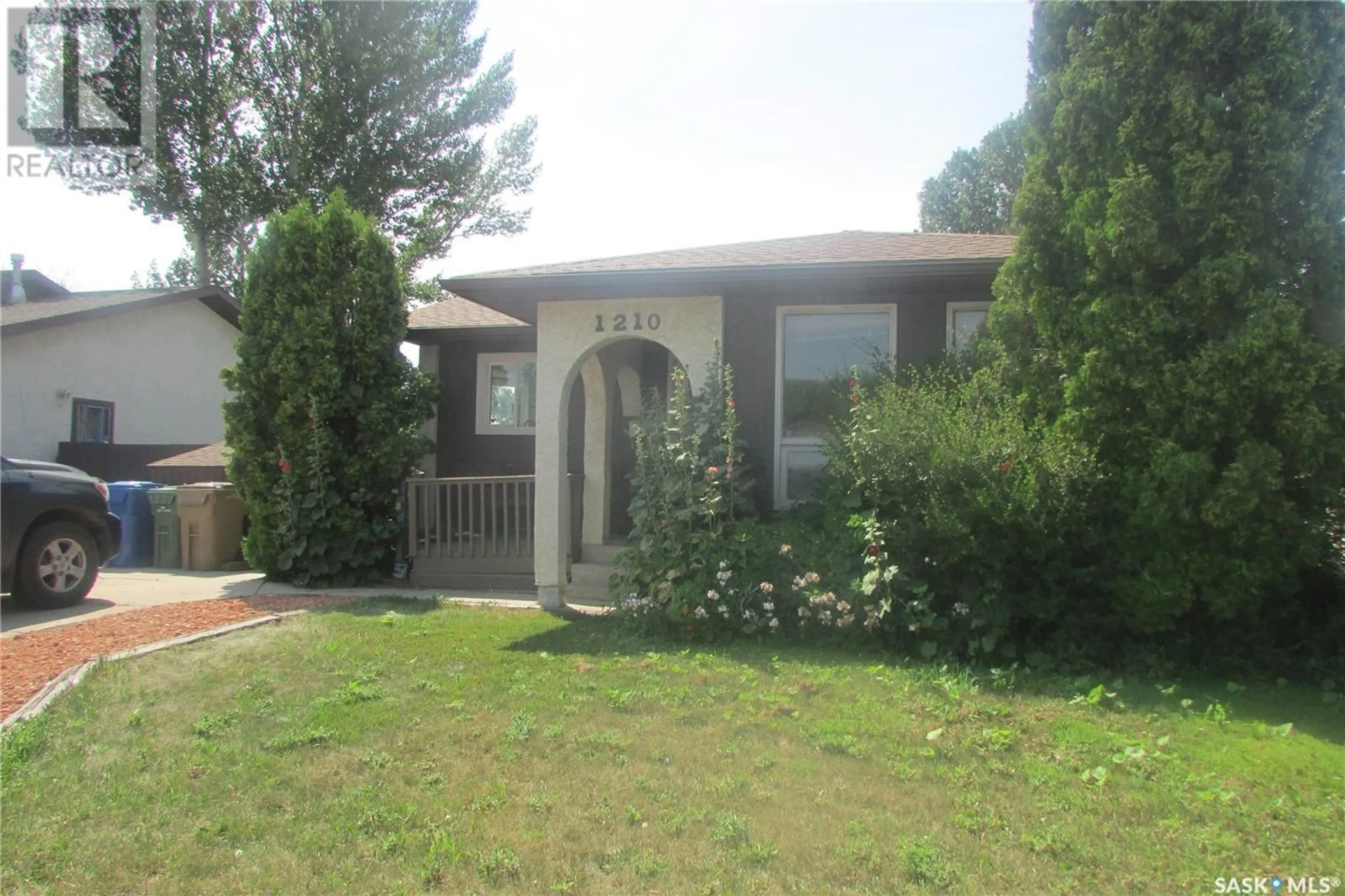 Home with vinyl exterior material, street for 1210 BROWN STREET, Regina Saskatchewan S4N6K6