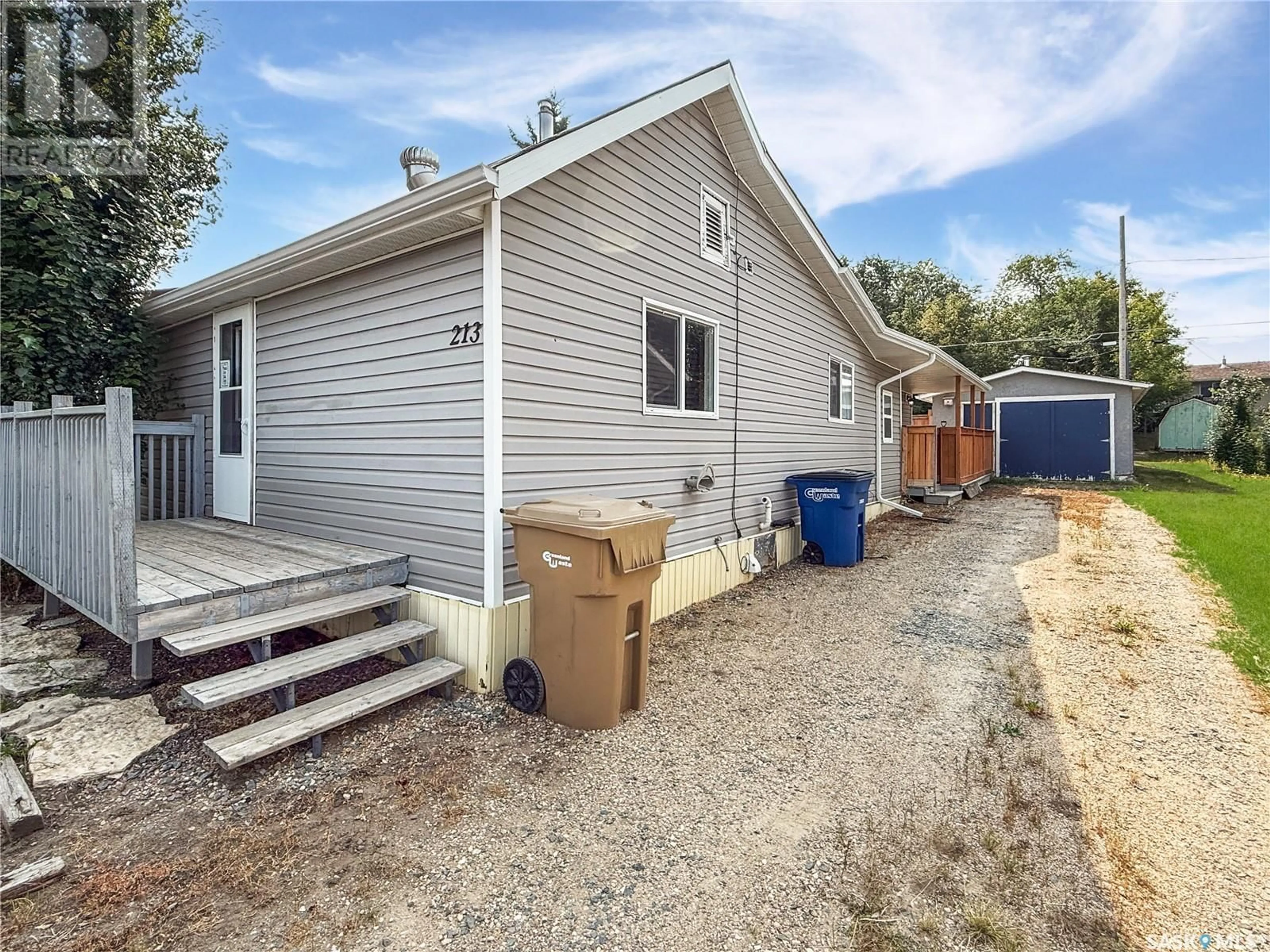 Home with vinyl exterior material, street for 213 5TH AVENUE, Shellbrook Saskatchewan S0J2E0