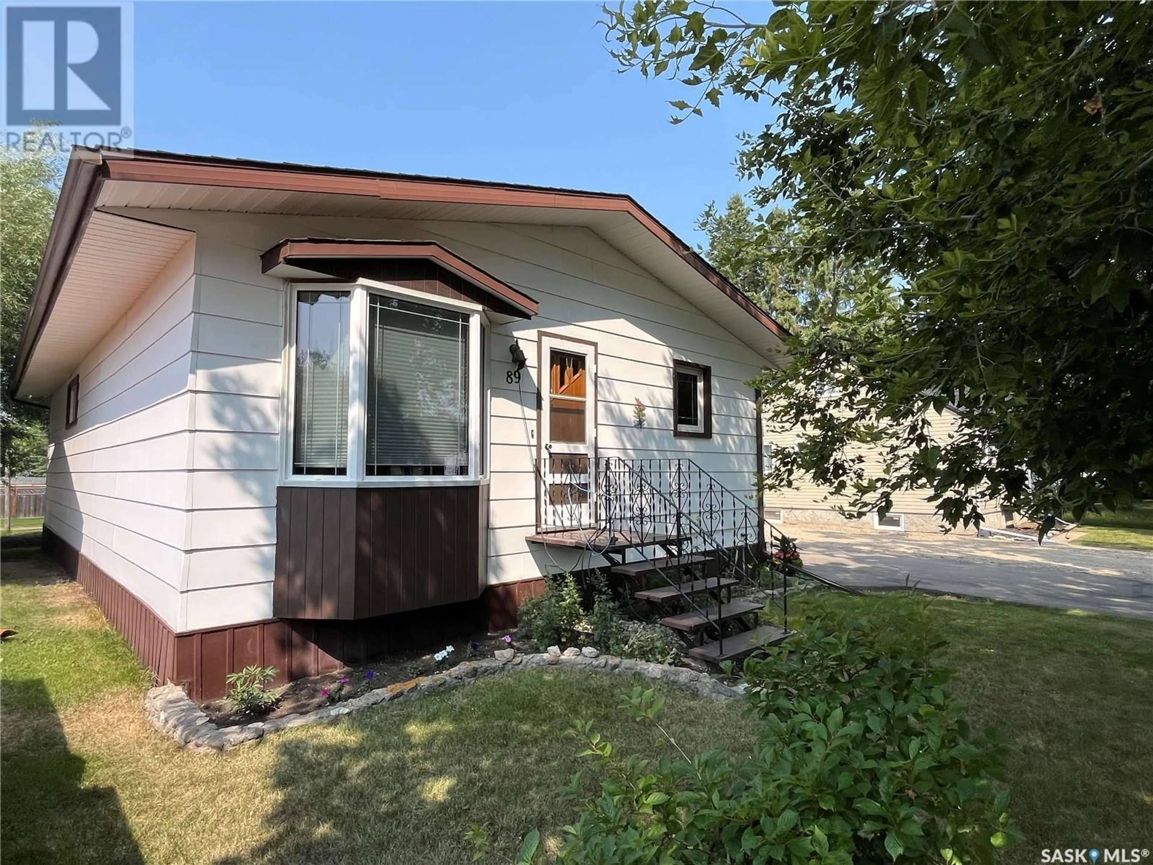Home with vinyl exterior material, street for 89 1ST STREET, Wadena Saskatchewan S0A4J0