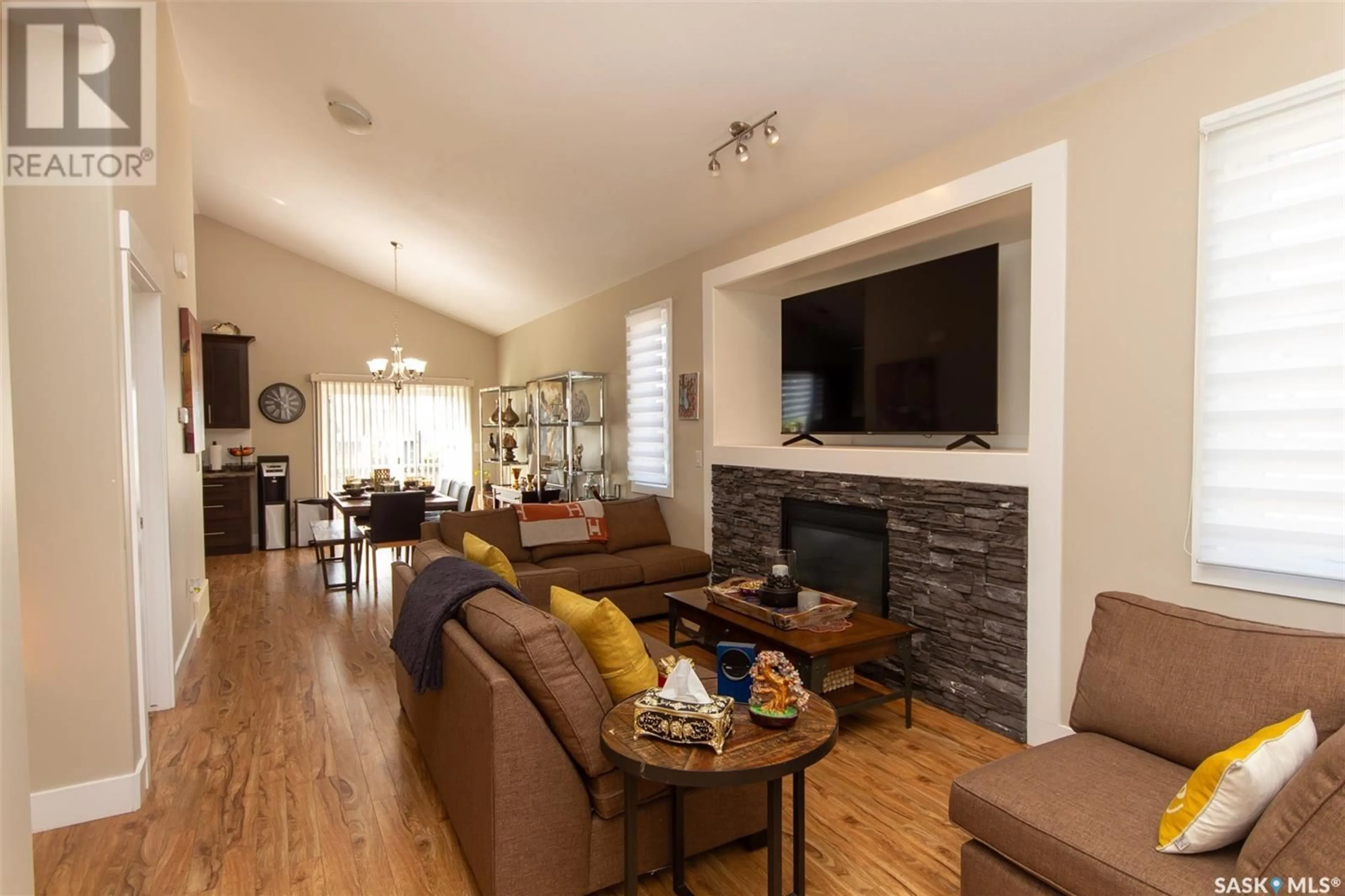 Living room with furniture, wood/laminate floor for 261 15TH STREET, Battleford Saskatchewan S0M0E0