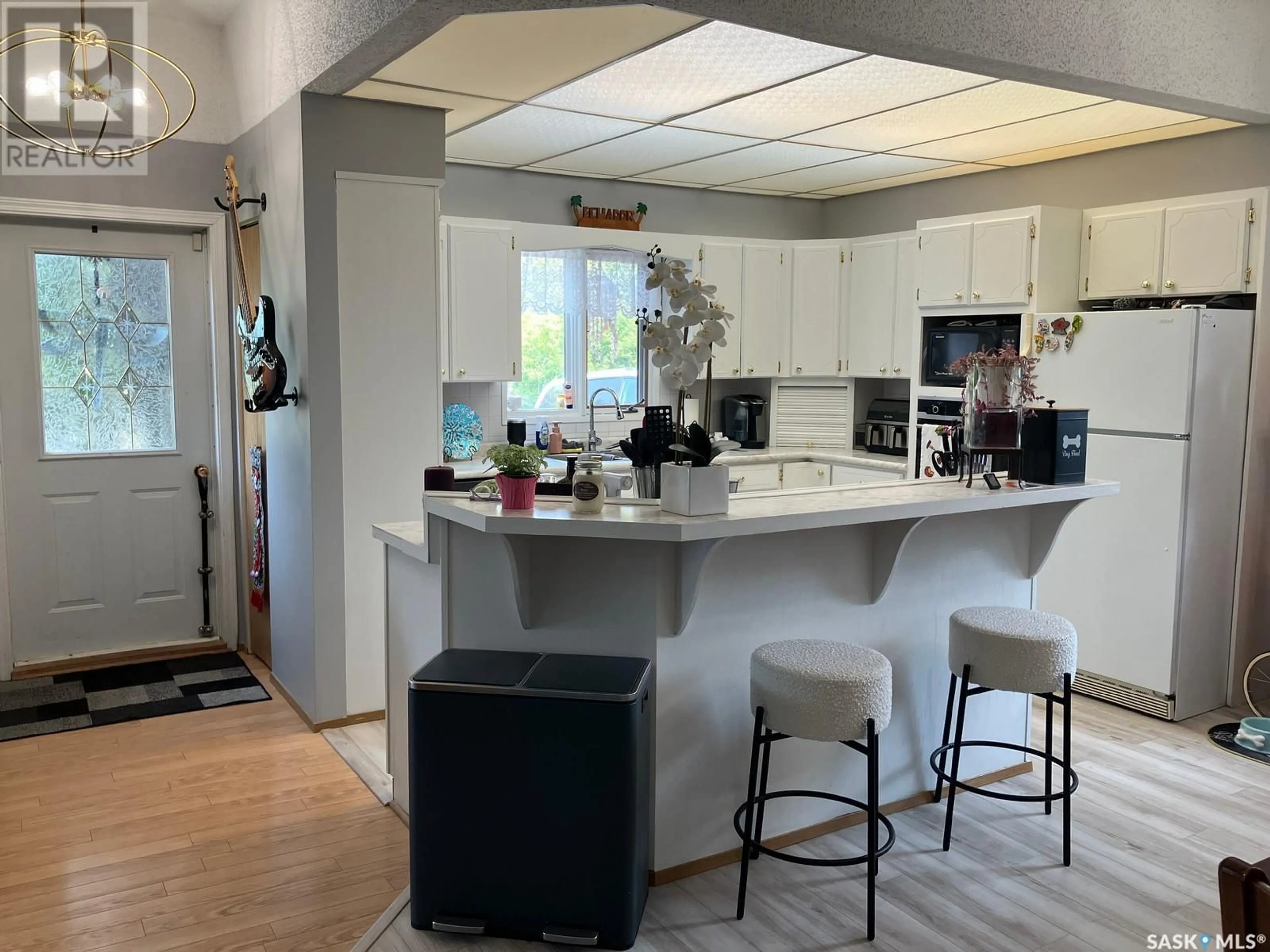 Open concept kitchen, ceramic/tile floor for 804 - 806 9TH AVENUE, Nipawin Saskatchewan S0E1E0