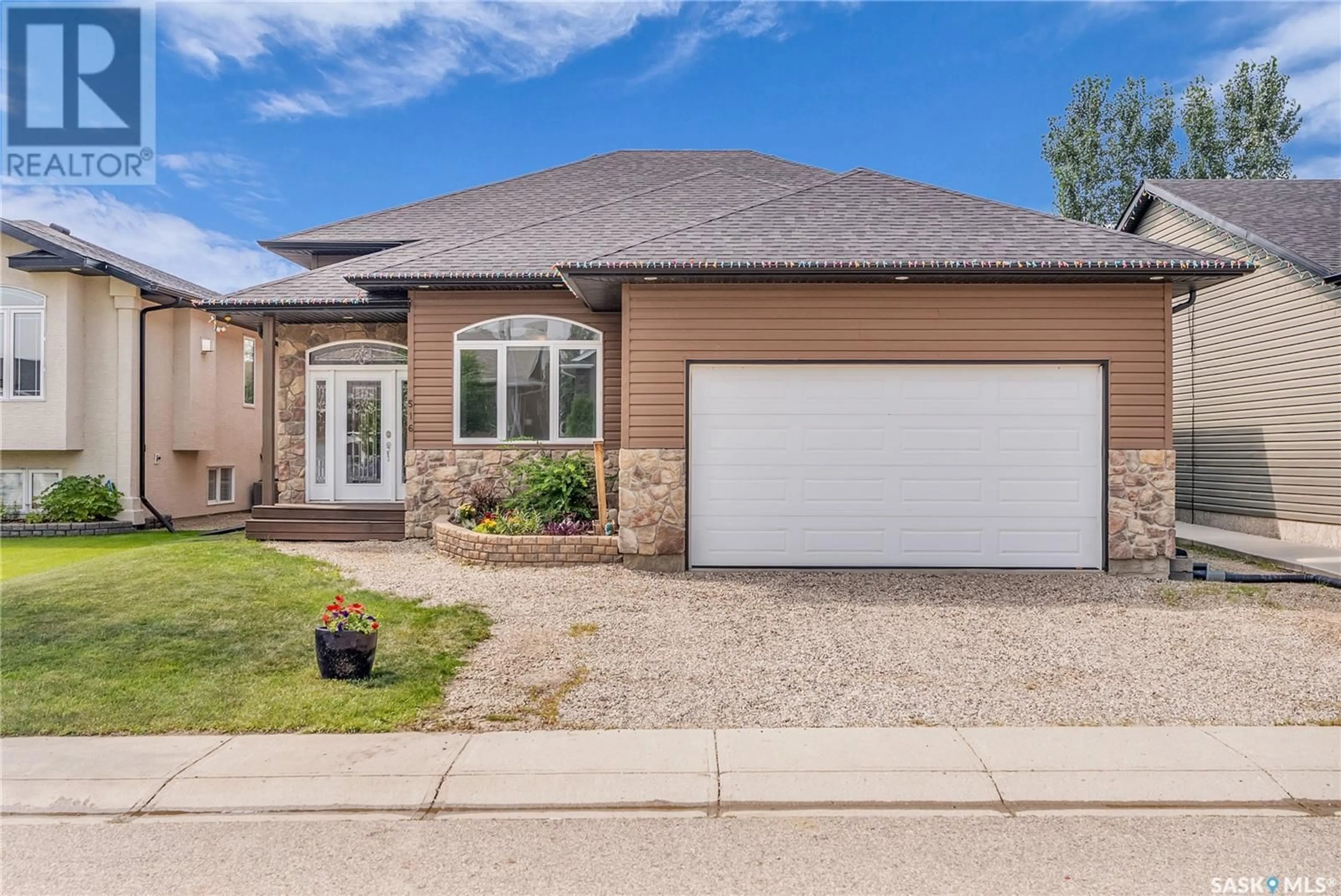 Home with brick exterior material, street for 516 ANTLER CRESCENT, Warman Saskatchewan S0K0A1