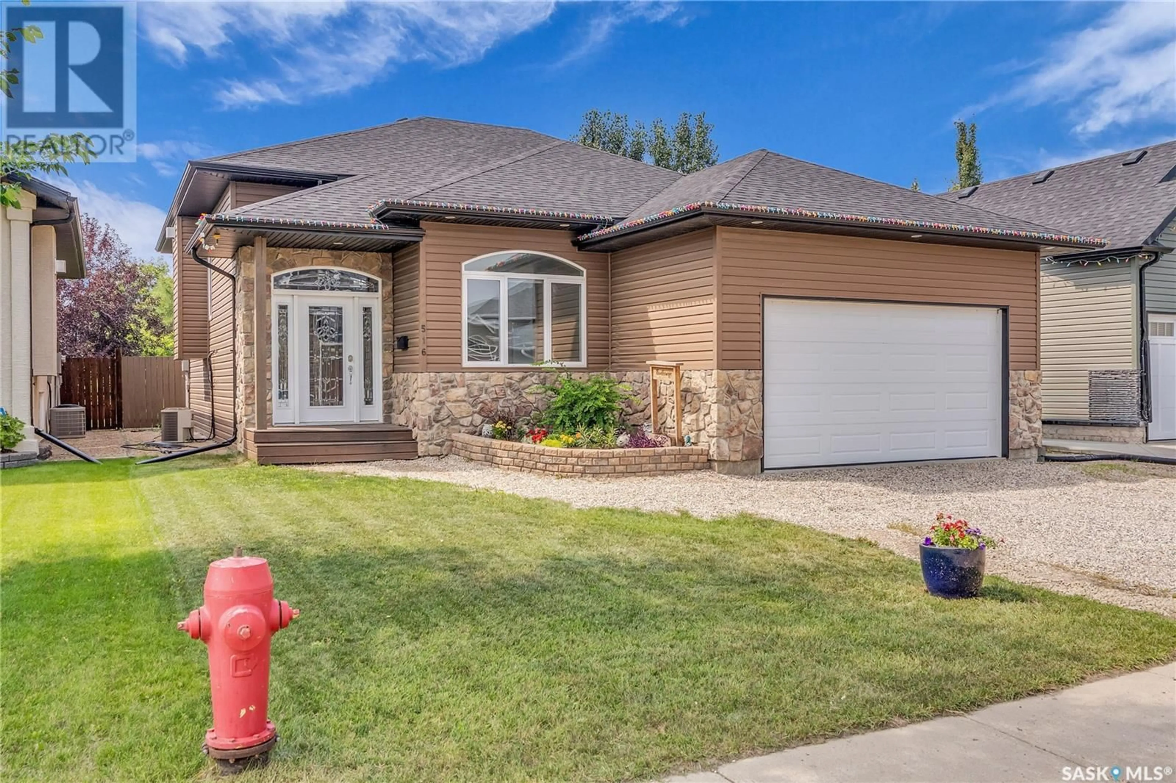 Home with brick exterior material, street for 516 ANTLER CRESCENT, Warman Saskatchewan S0K0A1