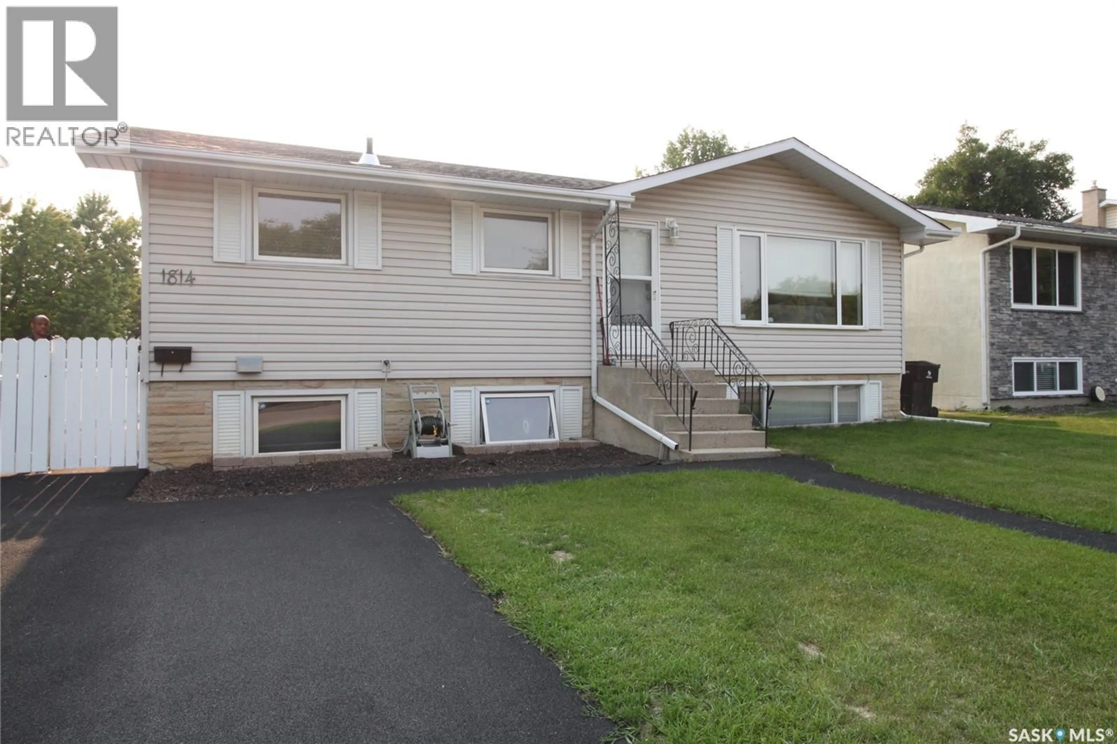 Home with vinyl exterior material, street for 1814 ARLINGTON AVENUE, Saskatoon Saskatchewan S7H2Y7