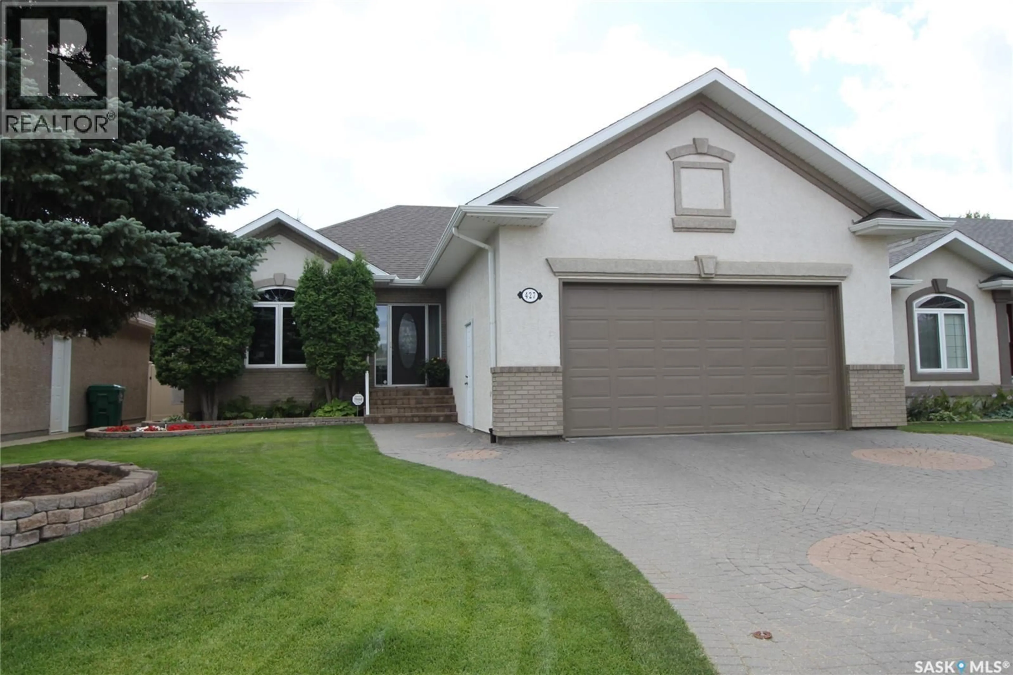 Home with vinyl exterior material, street for 427 BROOKMORE CRESCENT, Saskatoon Saskatchewan S7V1C2