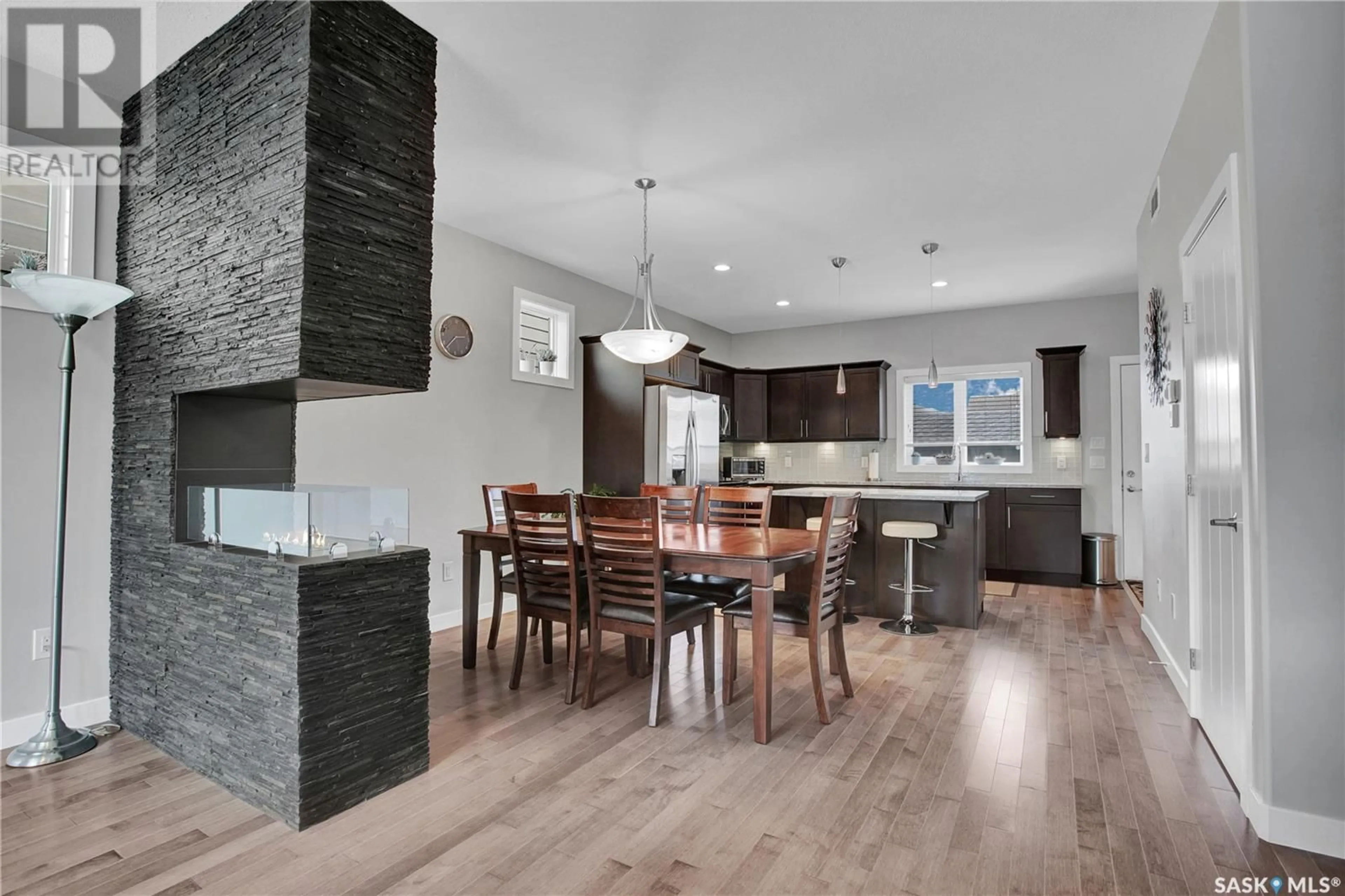 Open concept kitchen, wood/laminate floor for 111 - 17 ROSEWOOD GATE, Saskatoon Saskatchewan S7V0E5