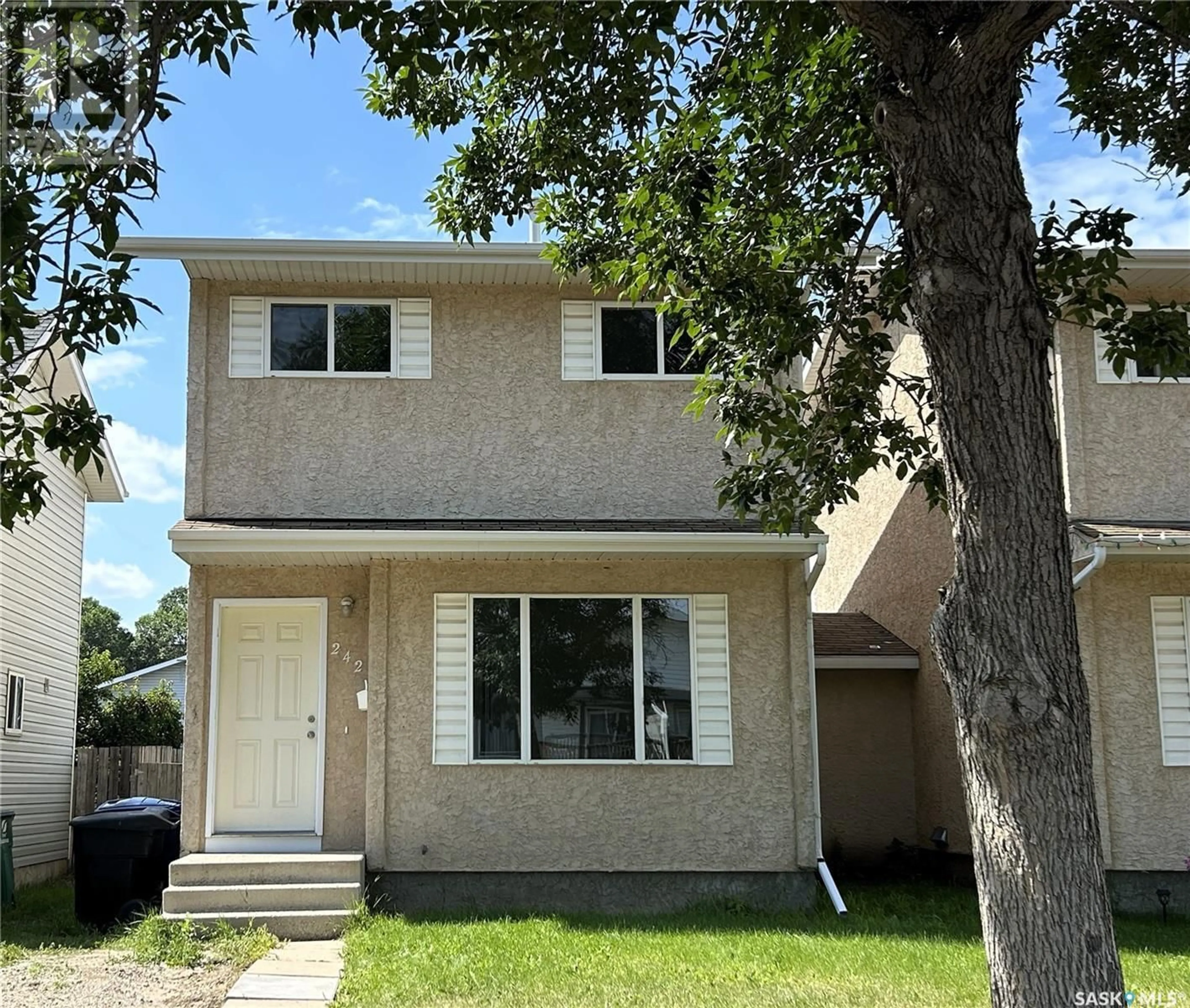 Home with vinyl exterior material, street for 242 LOCHRIE CRESCENT, Saskatoon Saskatchewan S7M5E4
