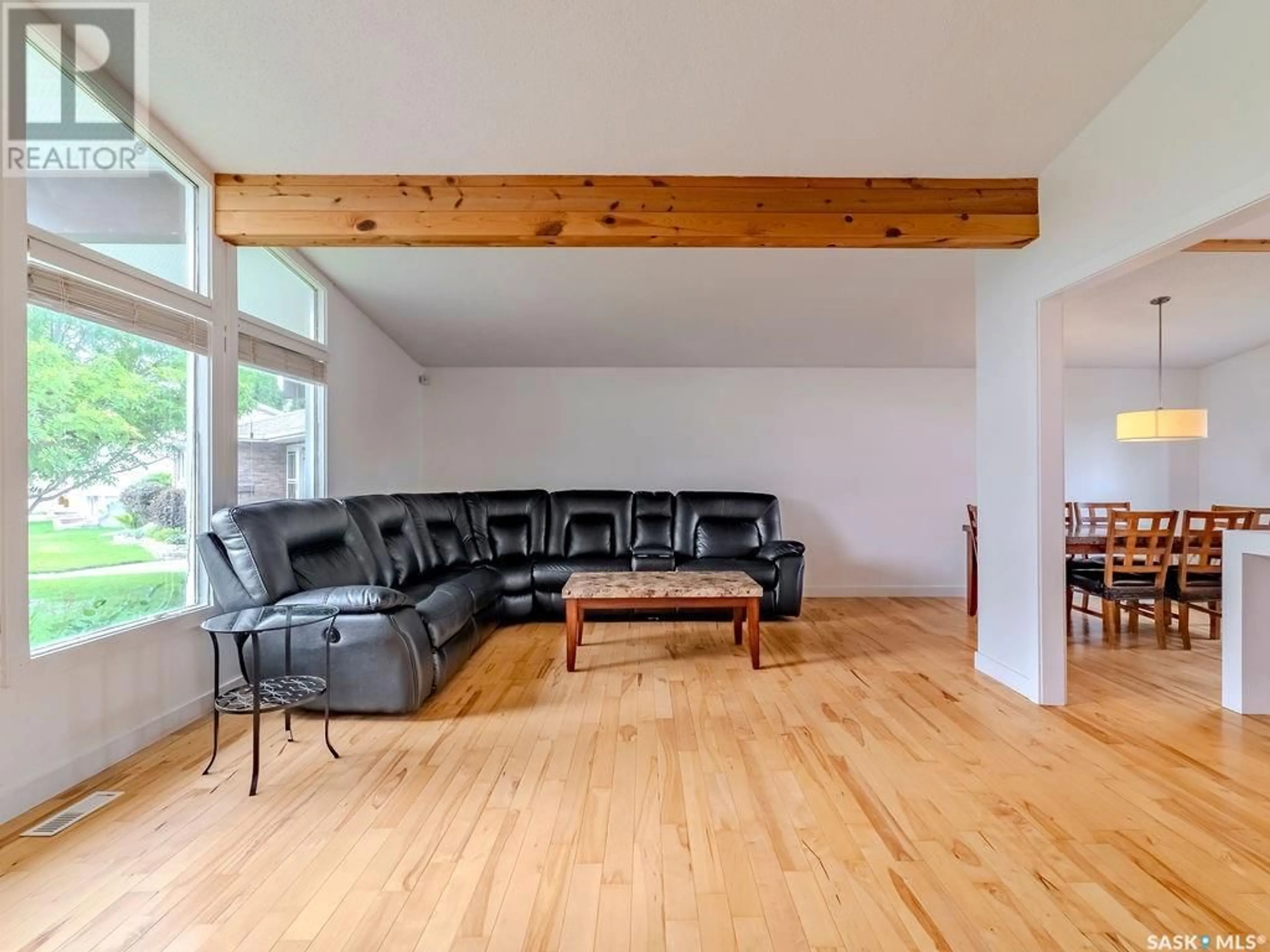 Living room with furniture, wood/laminate floor for 246 ANDERSON CRESCENT, Saskatoon Saskatchewan S7H4C2