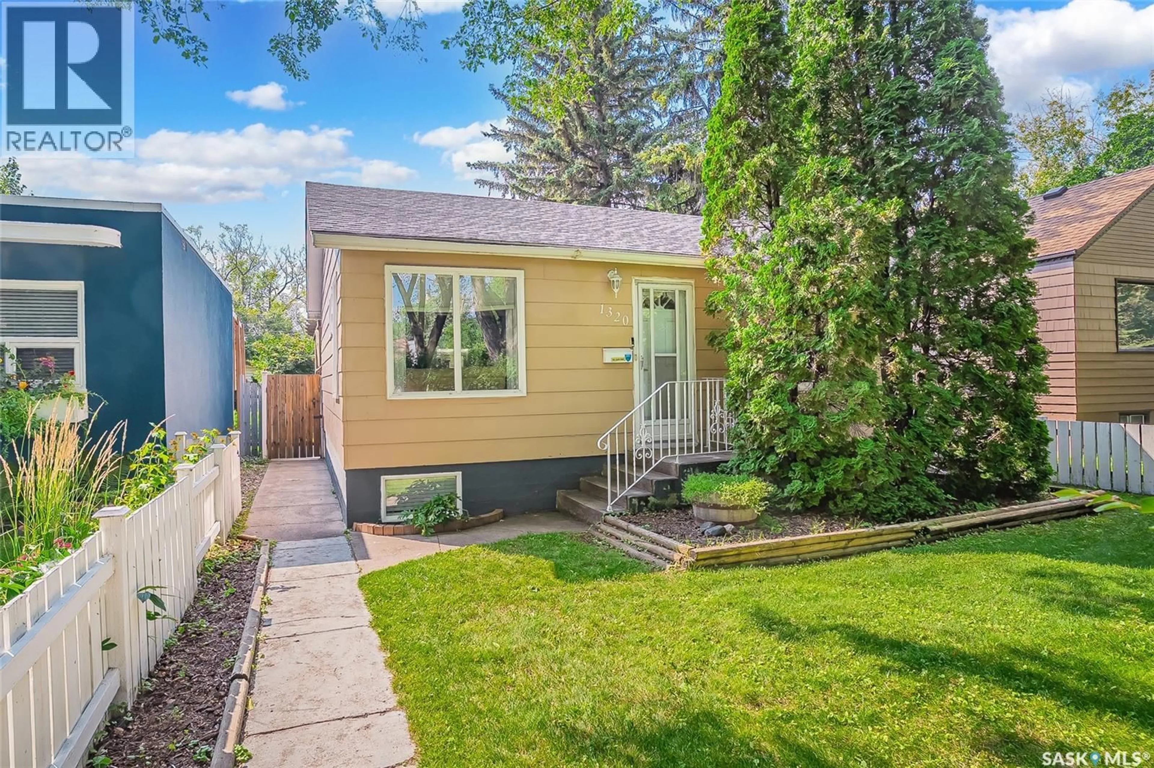 Home with vinyl exterior material, street for 1320 COY AVENUE, Saskatoon Saskatchewan S7M0H4