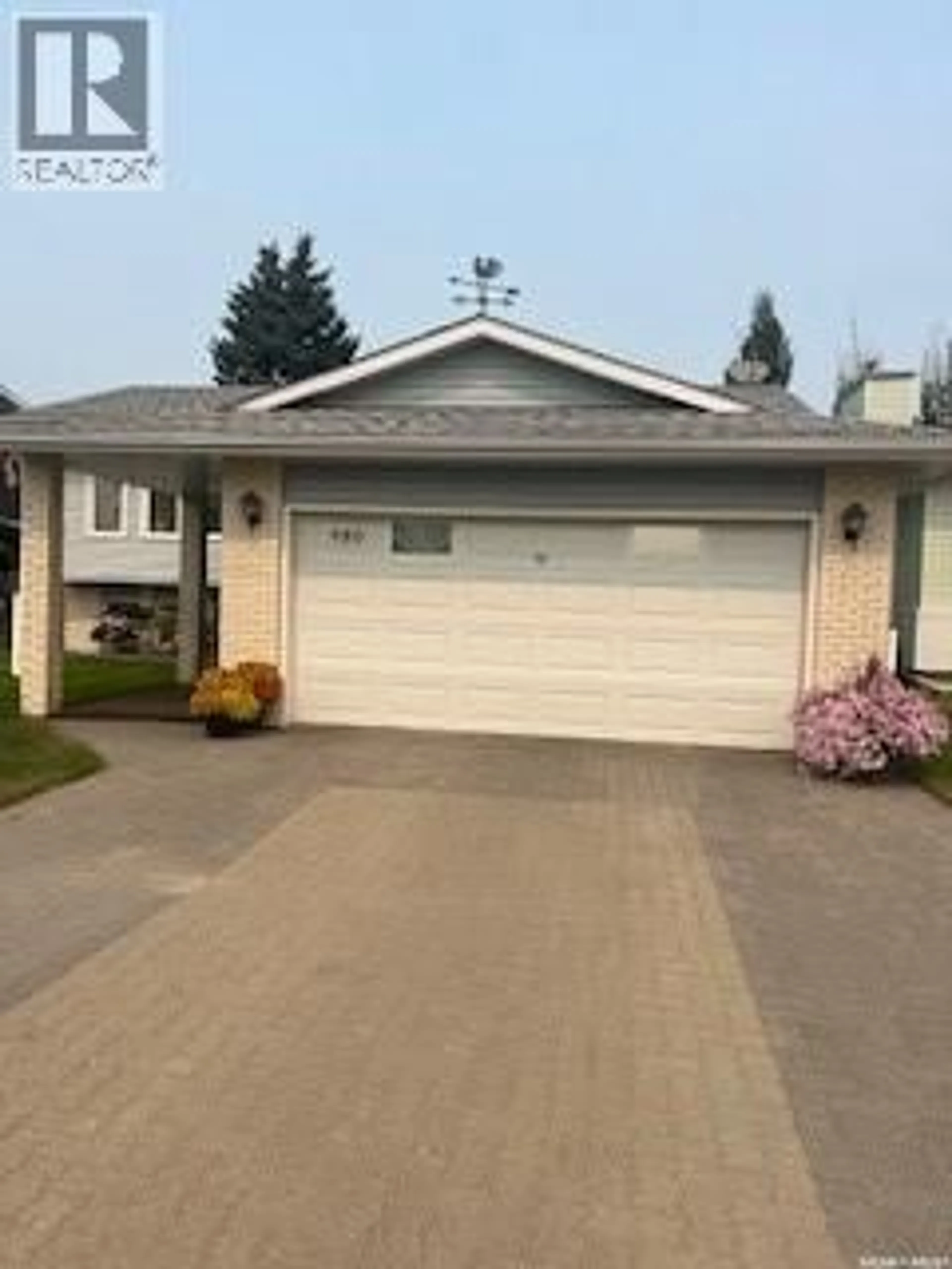 Home with vinyl exterior material, street for 980 1ST STREET, Prince Albert Saskatchewan S6V0C4