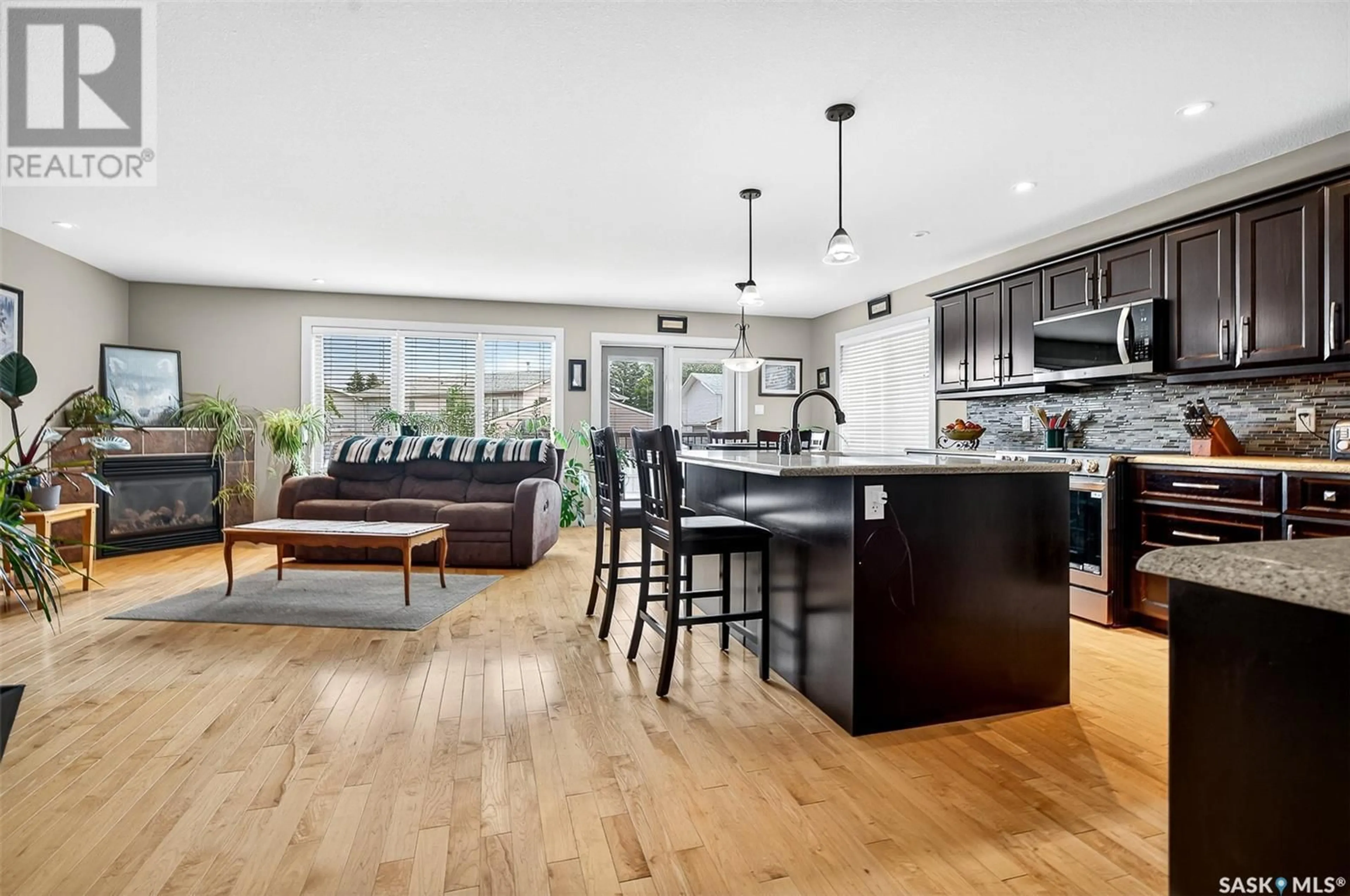 Open concept kitchen, wood/laminate floor for 19 EVERTON CRESCENT, Moose Jaw Saskatchewan S6K0A1