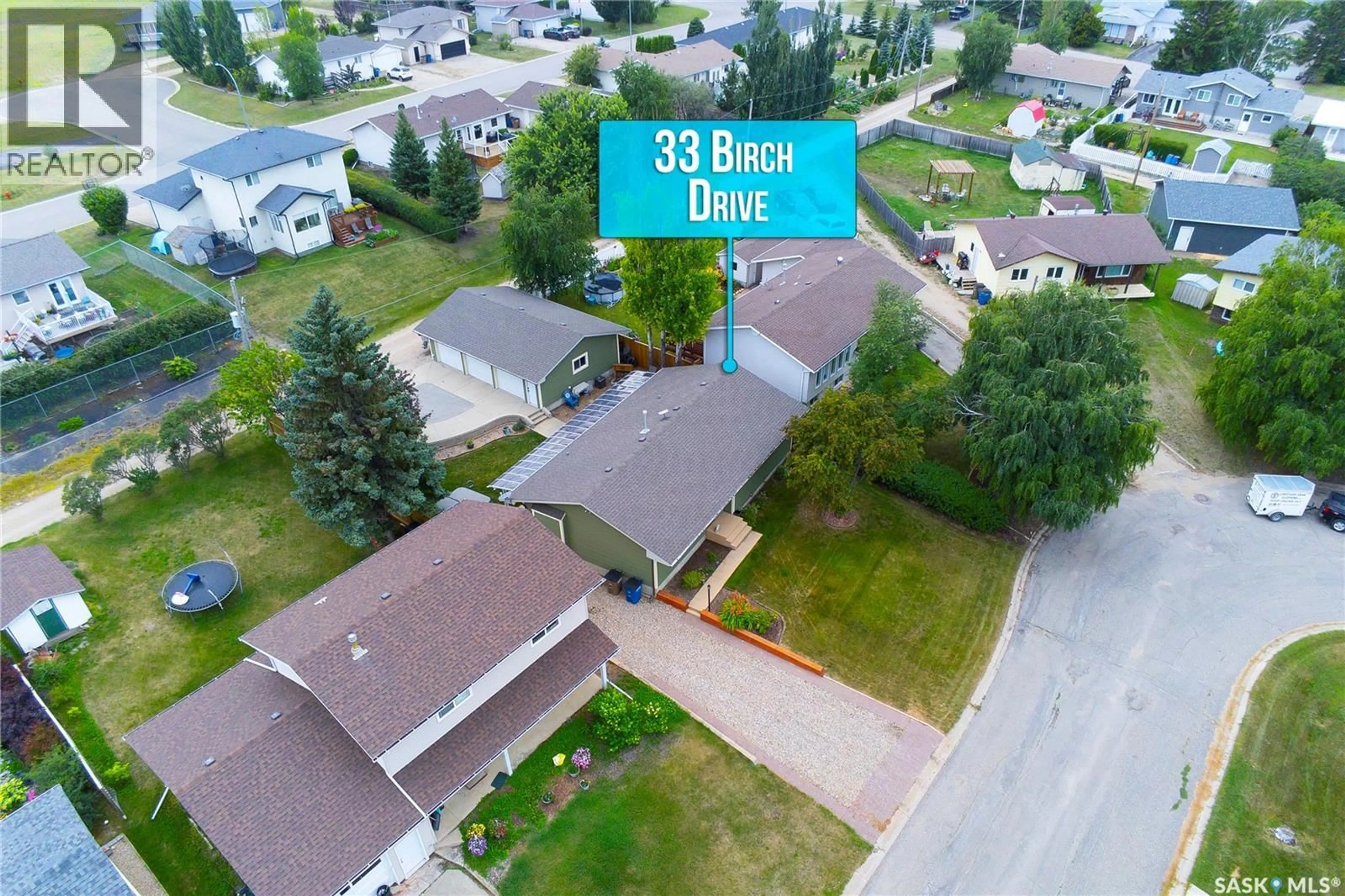 A pic from outside/outdoor area/front of a property/back of a property/a pic from drone, street for 33 BIRCH DRIVE, Birch Hills Saskatchewan S0J0G0
