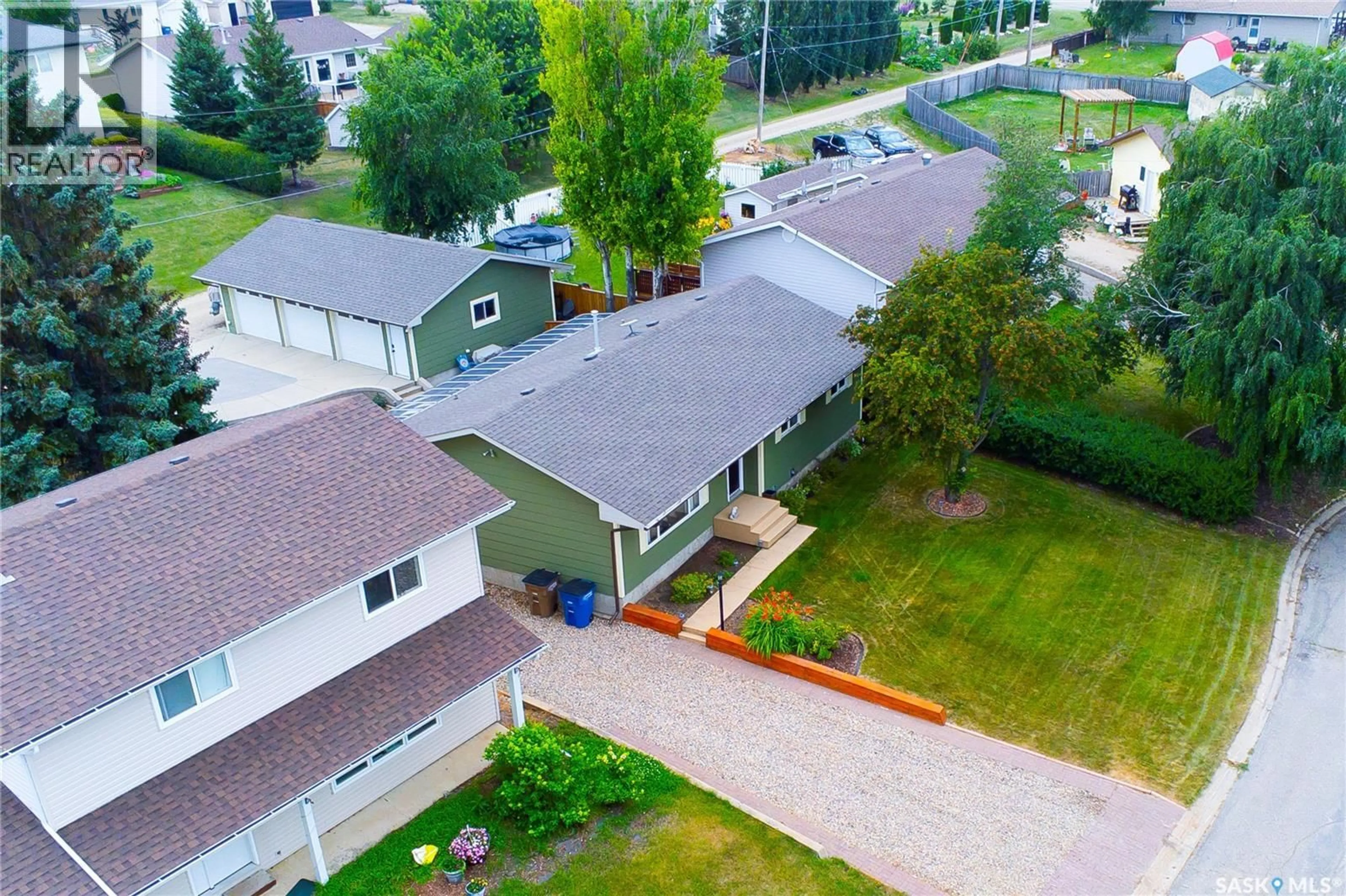 A pic from outside/outdoor area/front of a property/back of a property/a pic from drone, street for 33 BIRCH DRIVE, Birch Hills Saskatchewan S0J0G0