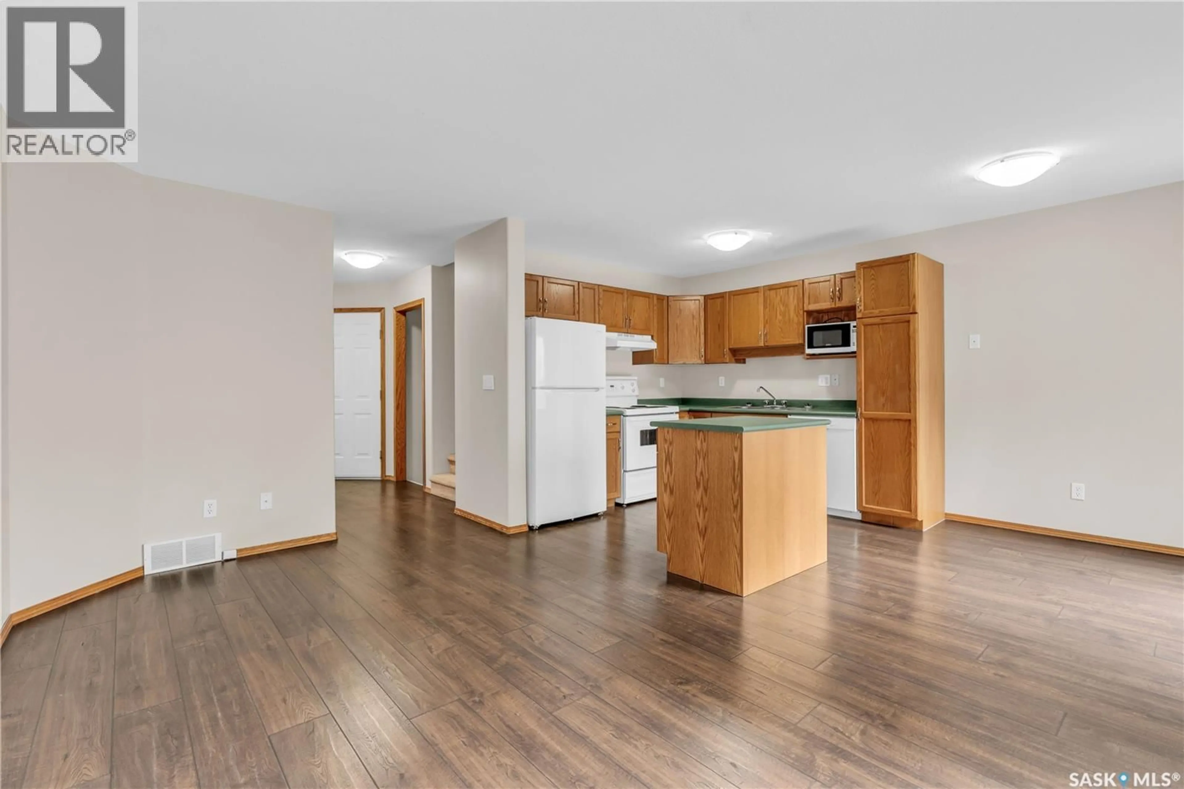 Open concept kitchen, wood/laminate floor for 30 - 410 KEEVIL CRESCENT, Saskatoon Saskatchewan S7N4R6