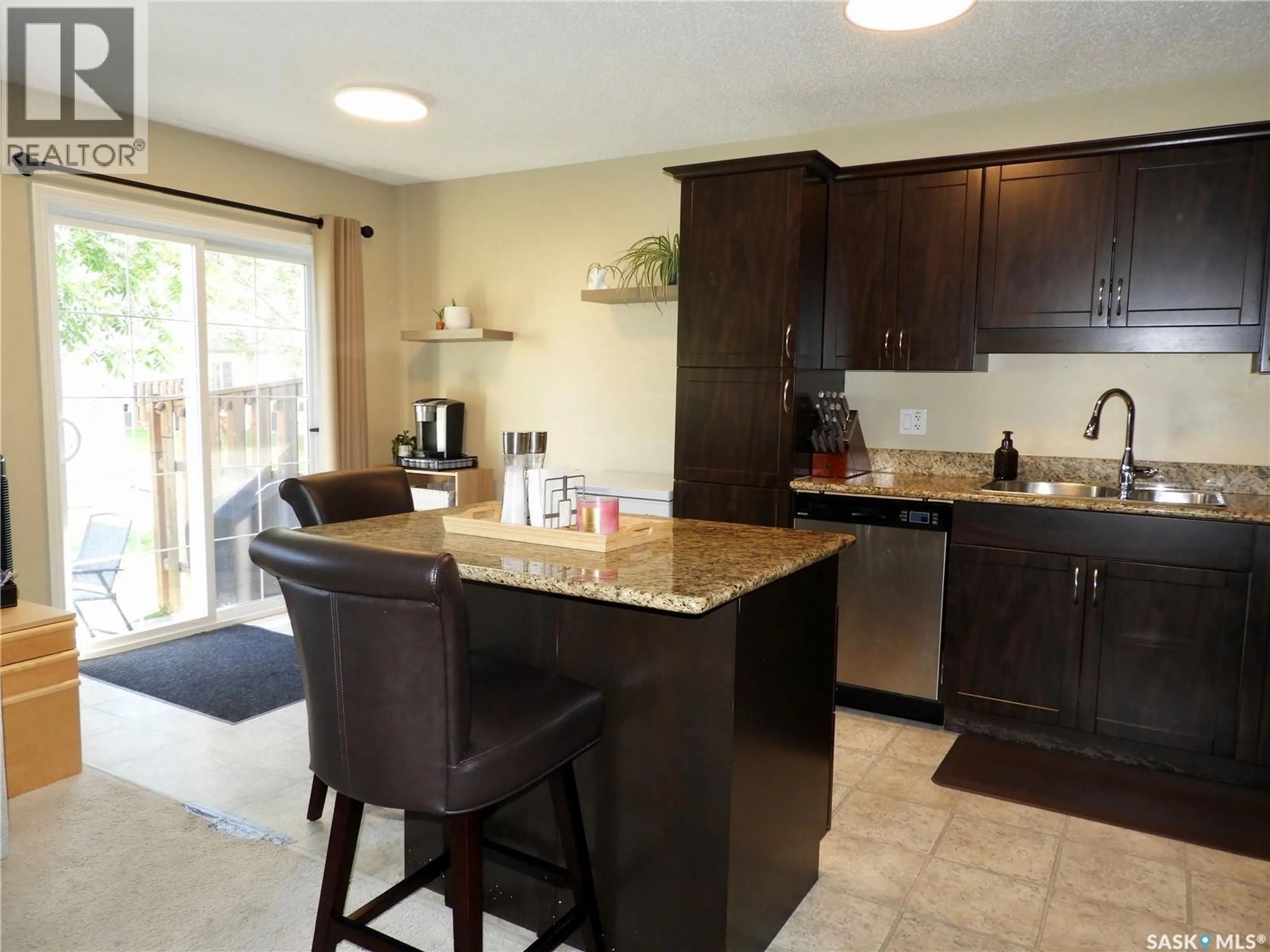 Open concept kitchen, ceramic/tile floor for 105 - 211 LYND CRESCENT, Saskatoon Saskatchewan S7T0C3