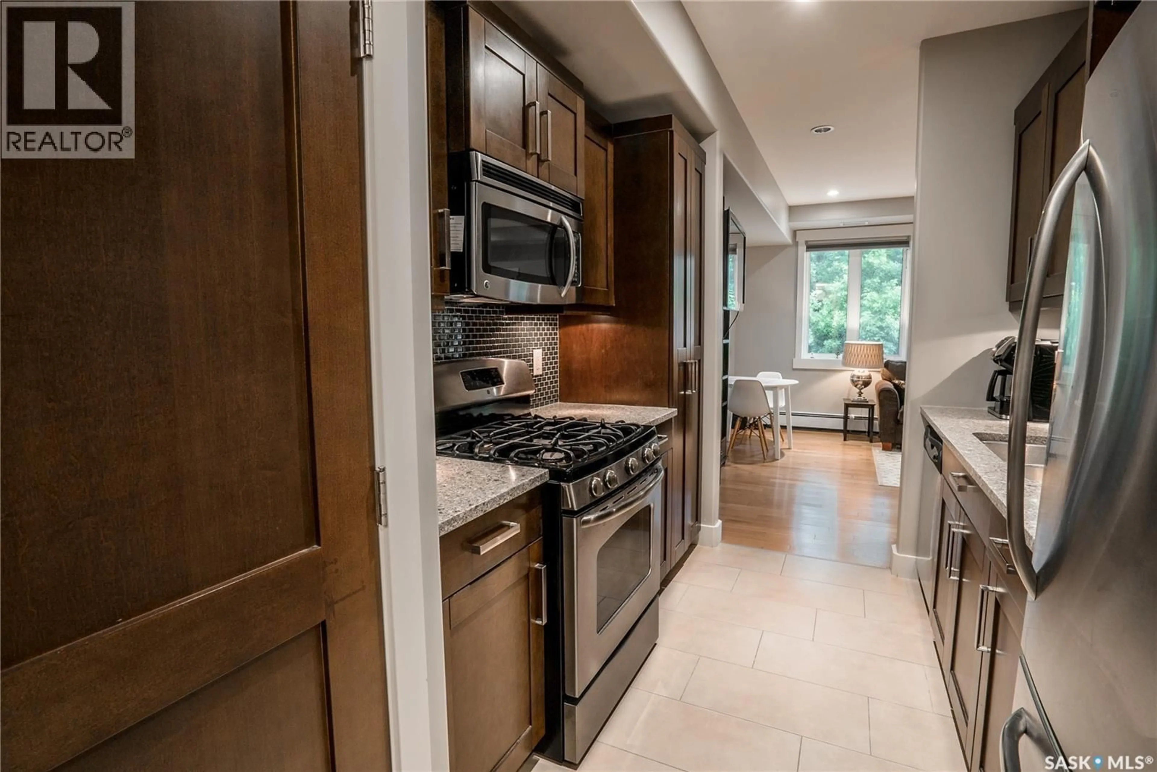 Open concept kitchen, ceramic/tile floor for 209 - 1132 COLLEGE DRIVE, Saskatoon Saskatchewan S7N0W2