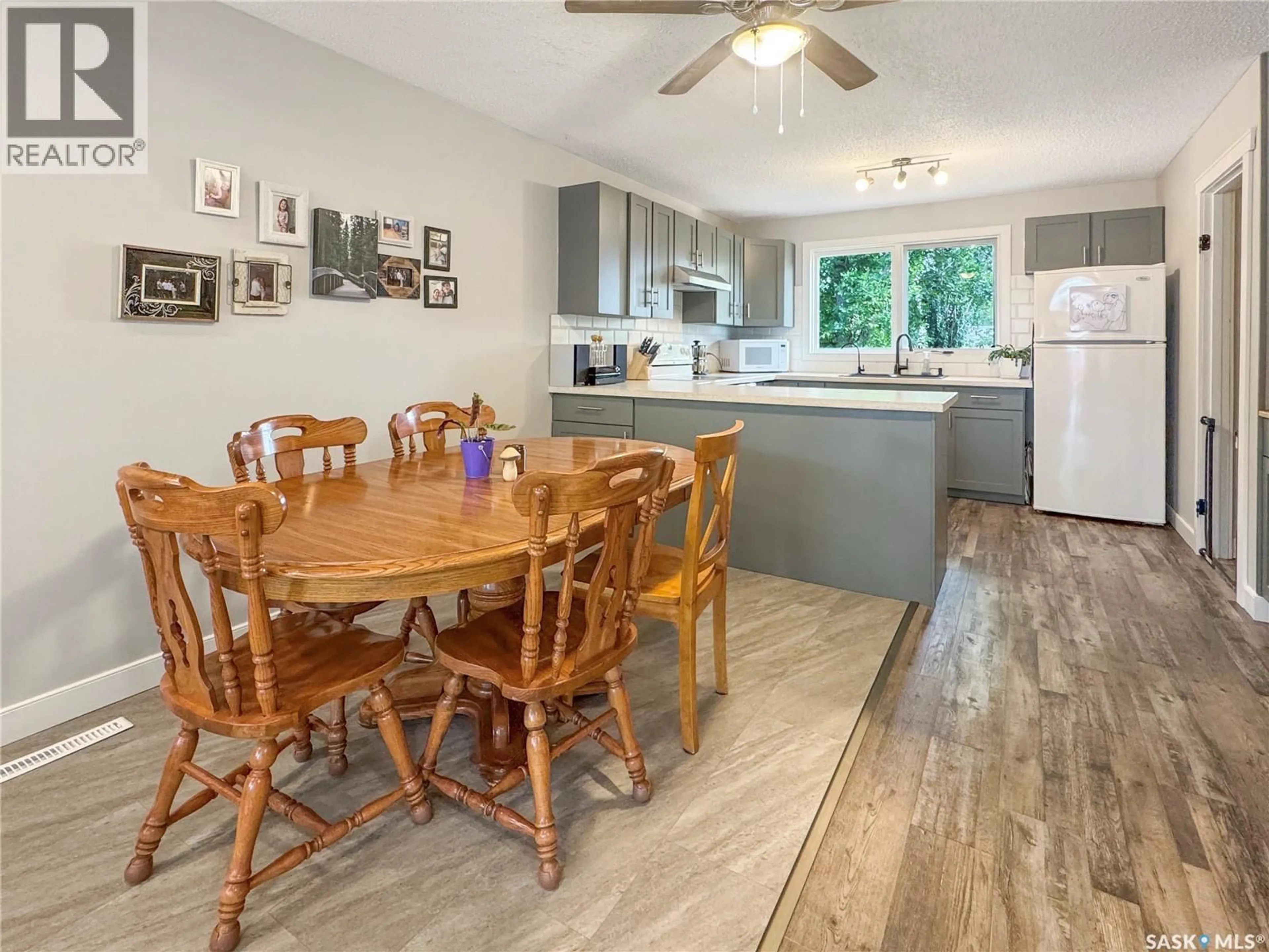 Open concept kitchen, wood/laminate floor for 9020 MITCHELL AVENUE, North Battleford Saskatchewan S9A3J7
