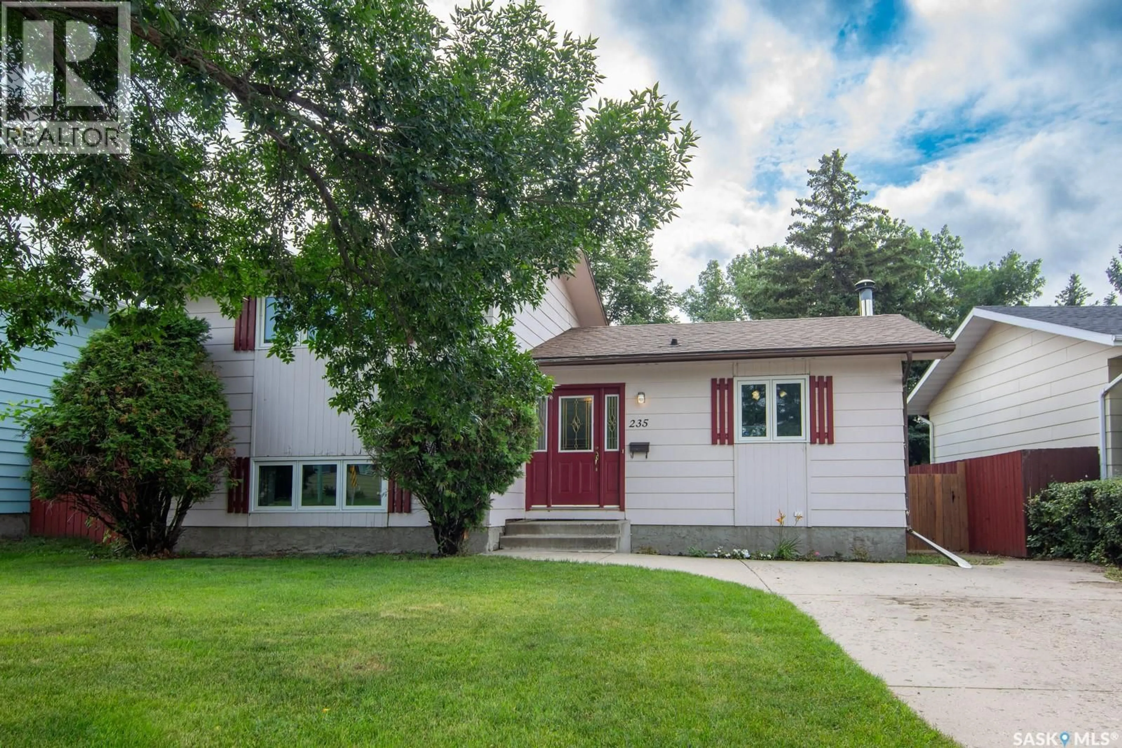Home with vinyl exterior material, street for 235 MCCORMACK ROAD, Saskatoon Saskatchewan S7M4V1