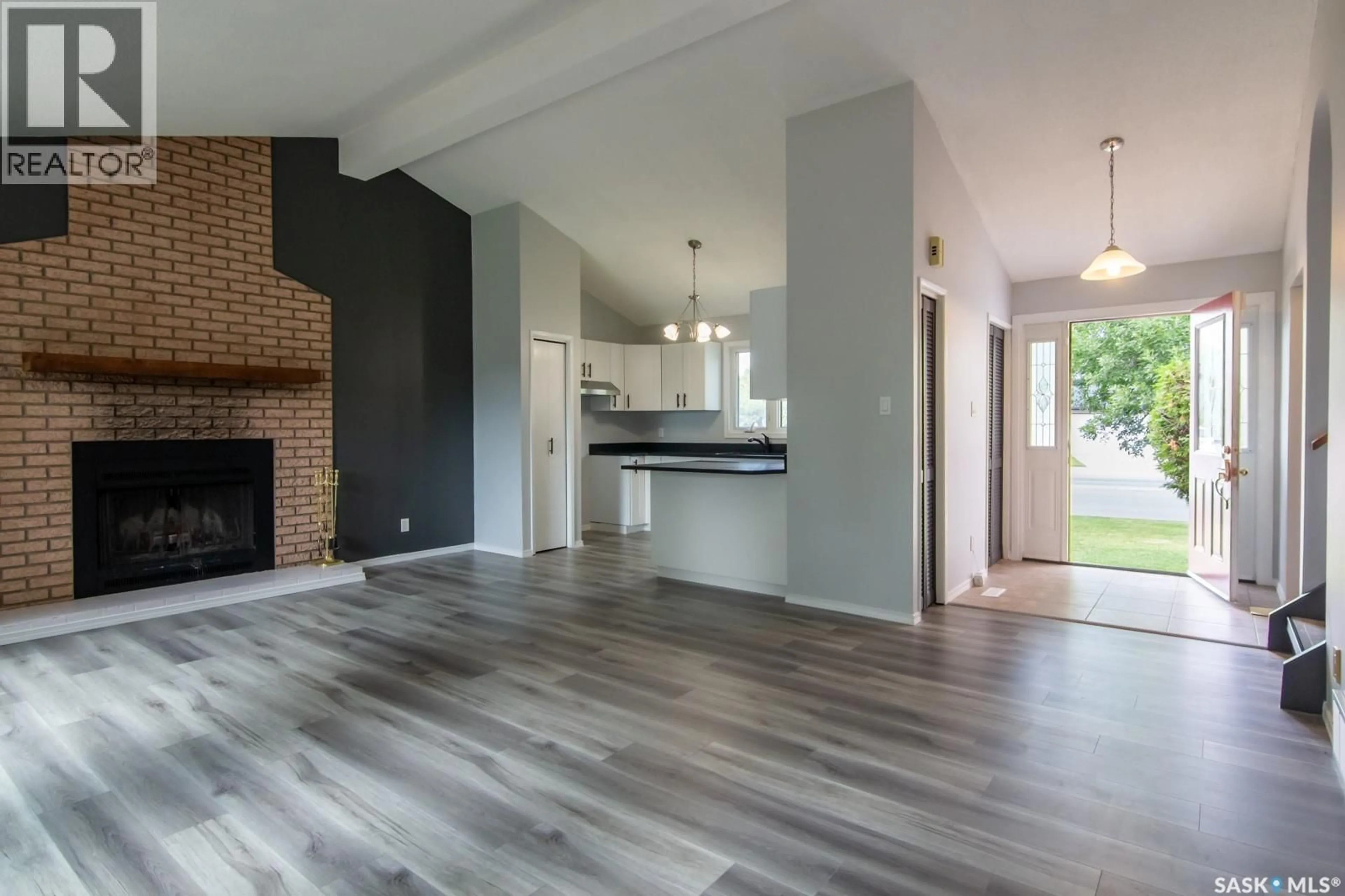 Open concept kitchen, wood/laminate floor for 235 MCCORMACK ROAD, Saskatoon Saskatchewan S7M4V1