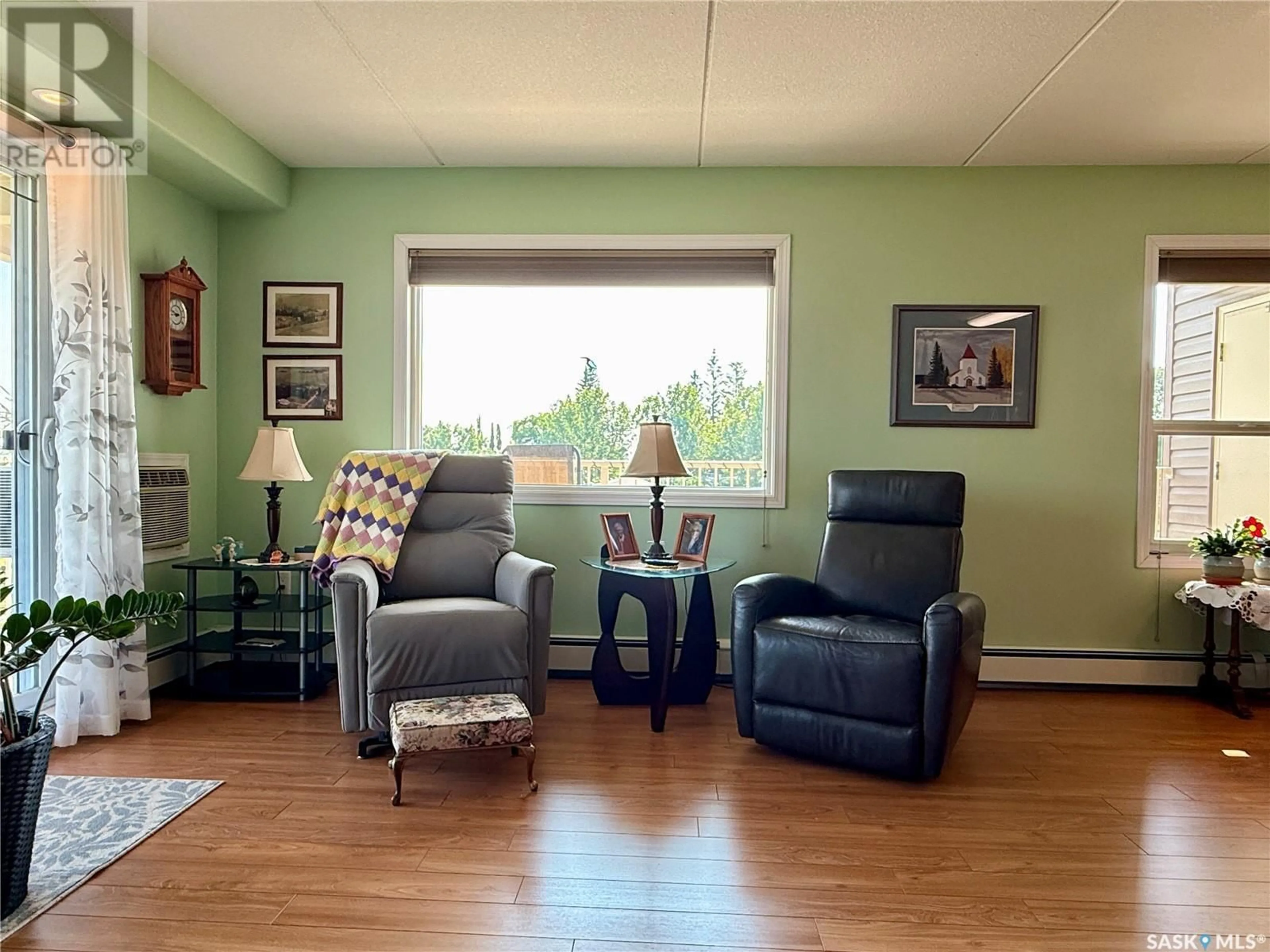 Living room with furniture, wood/laminate floor for 207 2 18TH STREET, Battleford Saskatchewan S0M0E0
