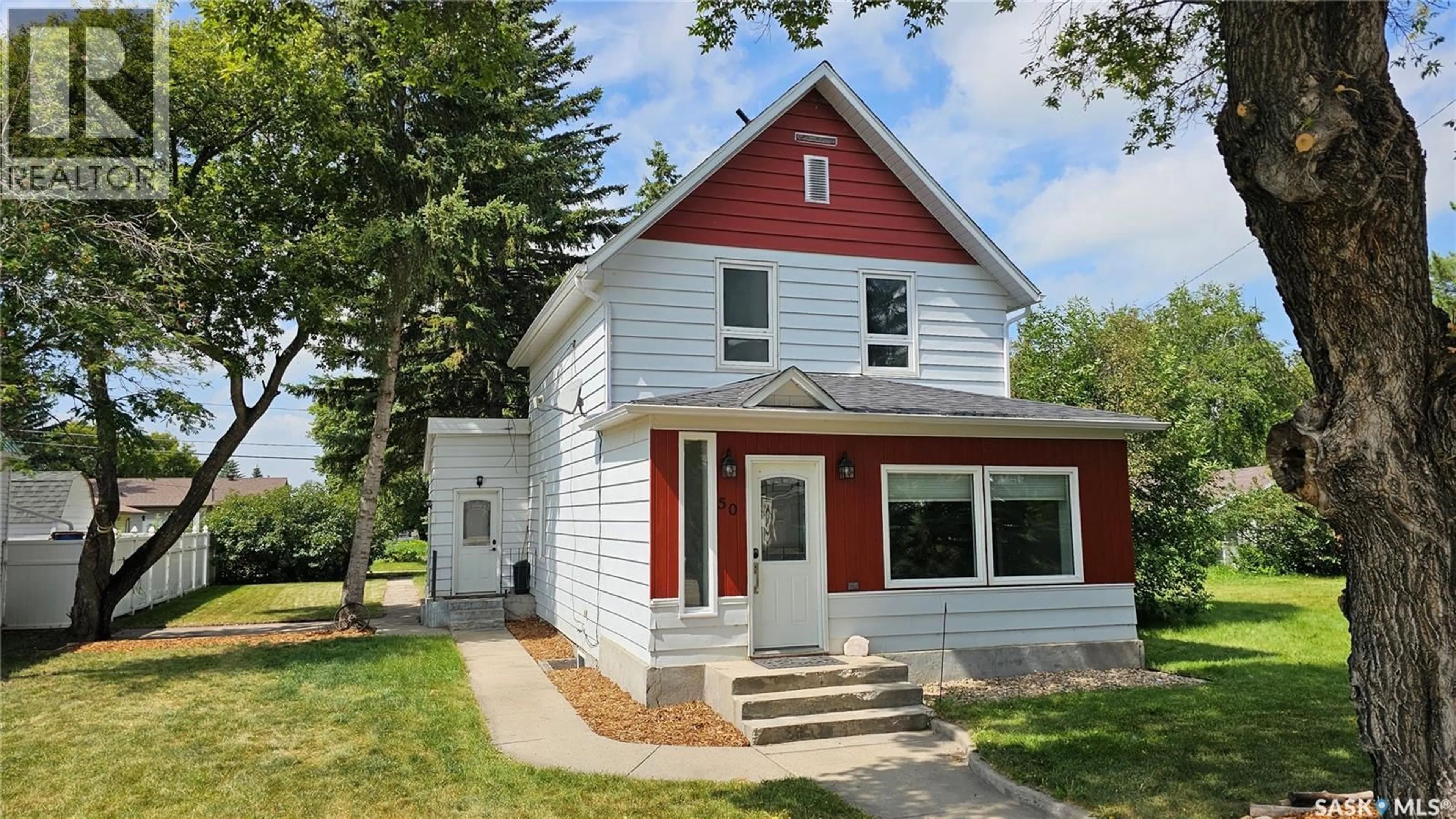 Home with vinyl exterior material, street for 50 ANTRIM STREET, Lanigan Saskatchewan S0K2M0