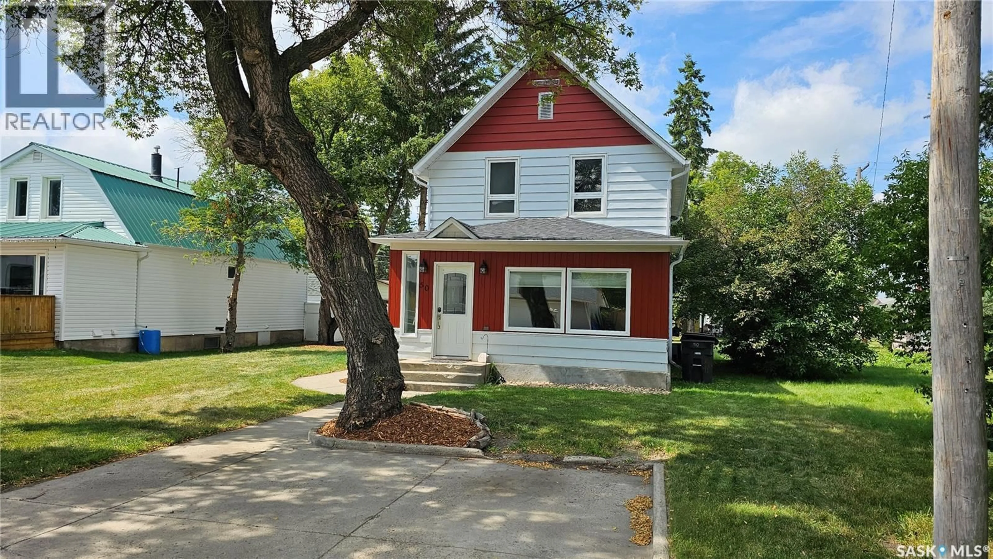 Home with vinyl exterior material, street for 50 ANTRIM STREET, Lanigan Saskatchewan S0K2M0