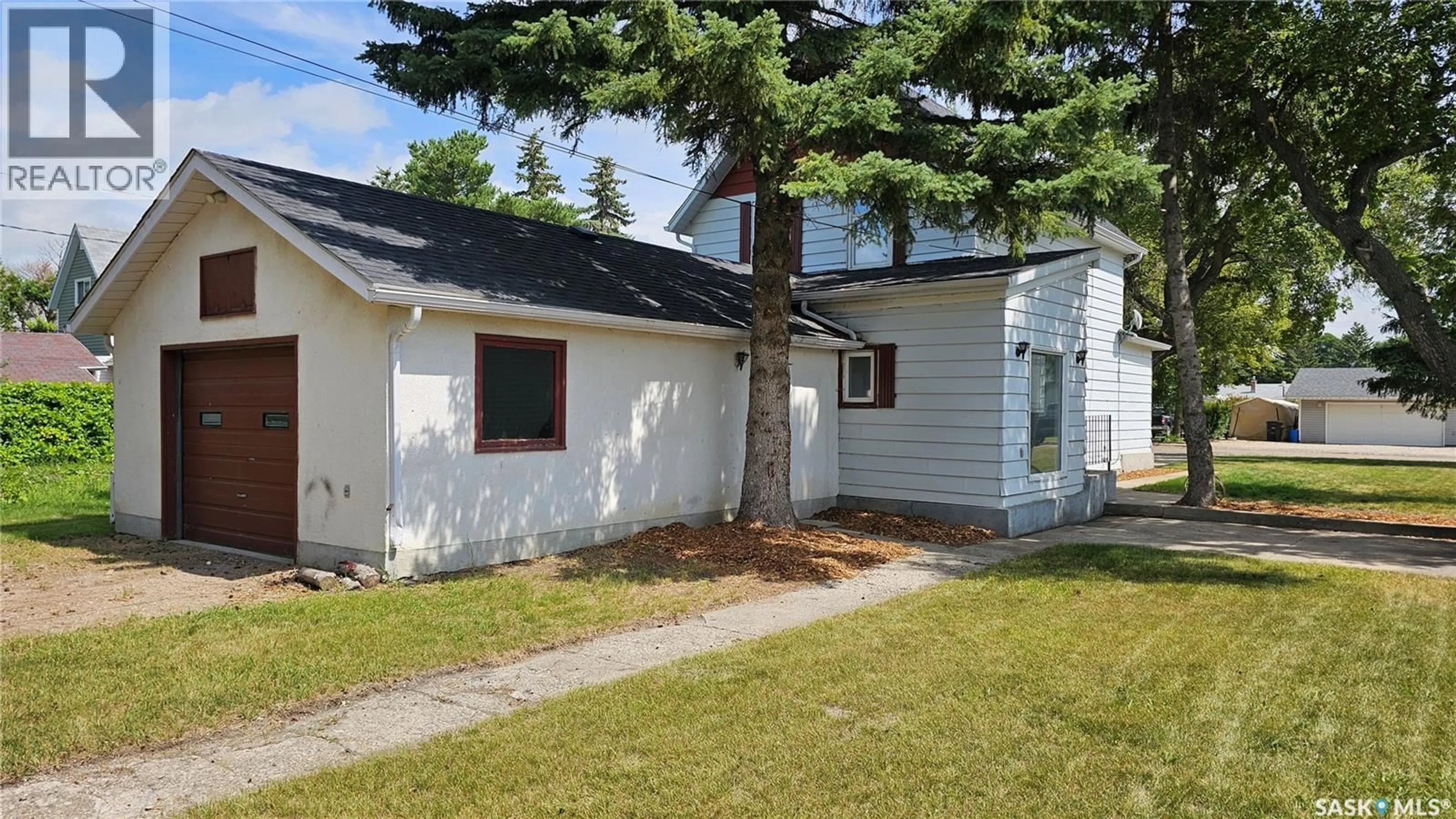 Home with vinyl exterior material, street for 50 ANTRIM STREET, Lanigan Saskatchewan S0K2M0