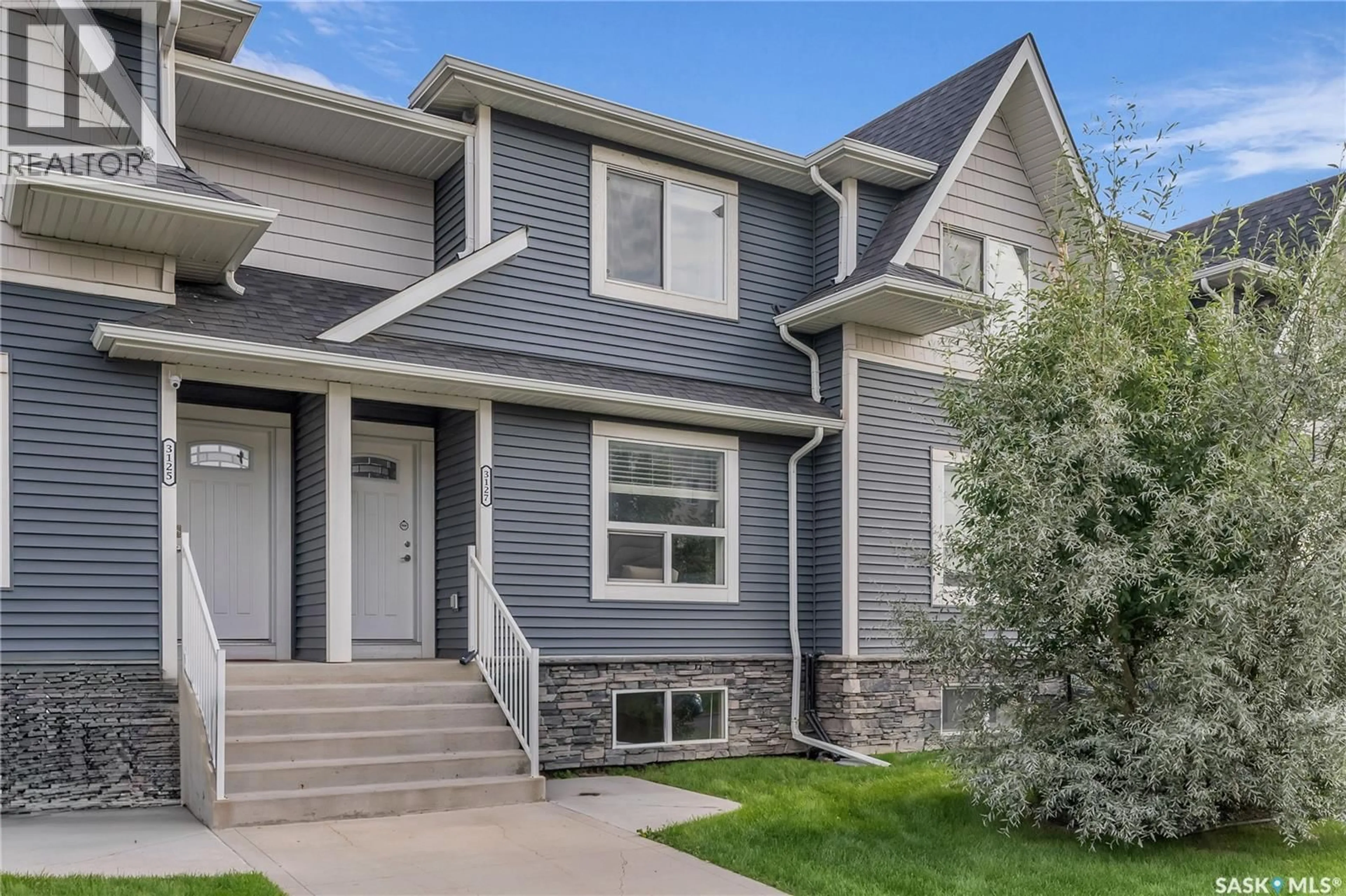 Home with vinyl exterior material, street for 3127 MCCLOCKLIN ROAD, Saskatoon Saskatchewan S7R0J1