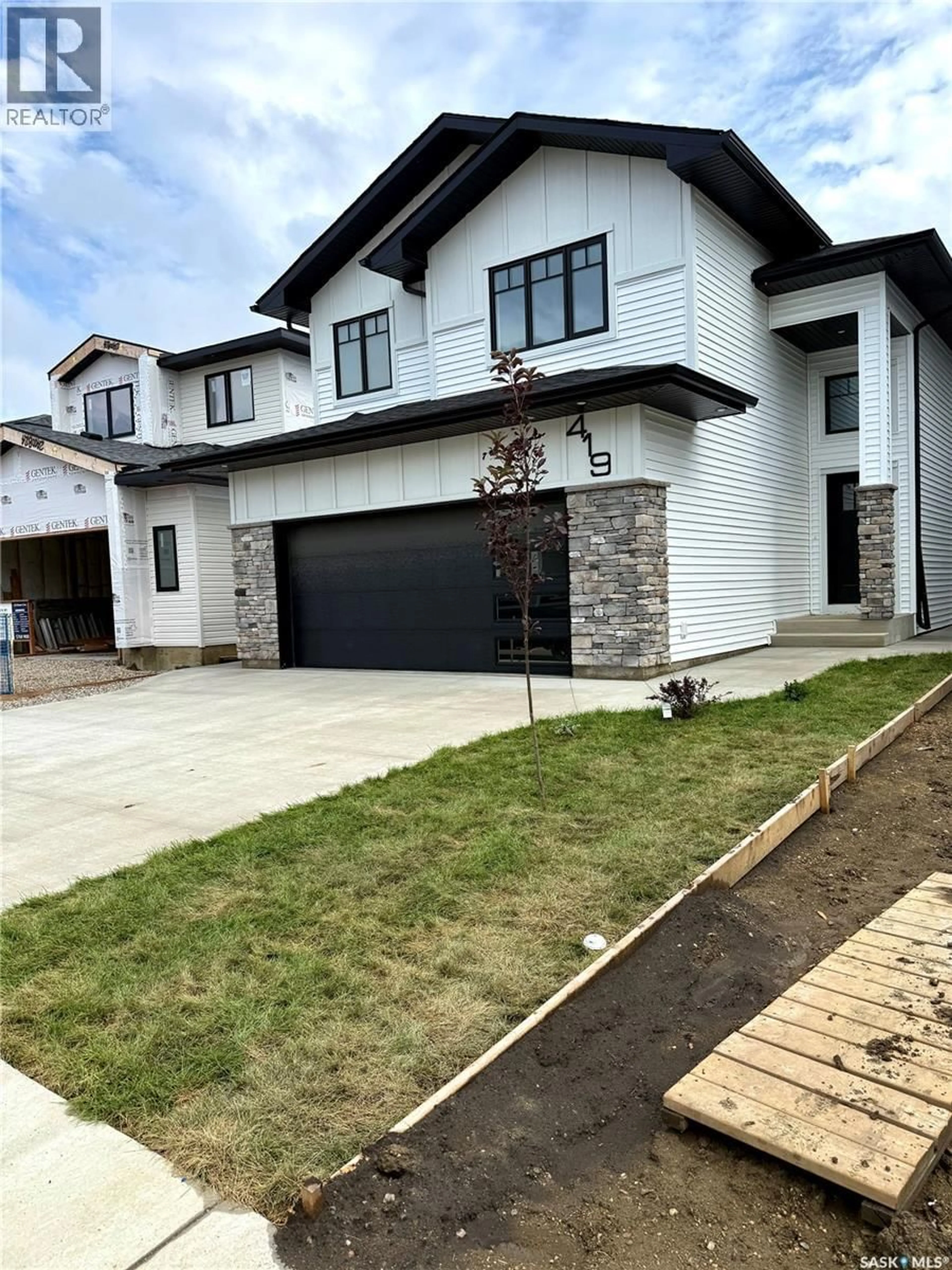Home with brick exterior material, street for 419 DORAN CRESCENT, Saskatoon Saskatchewan S7V1W2