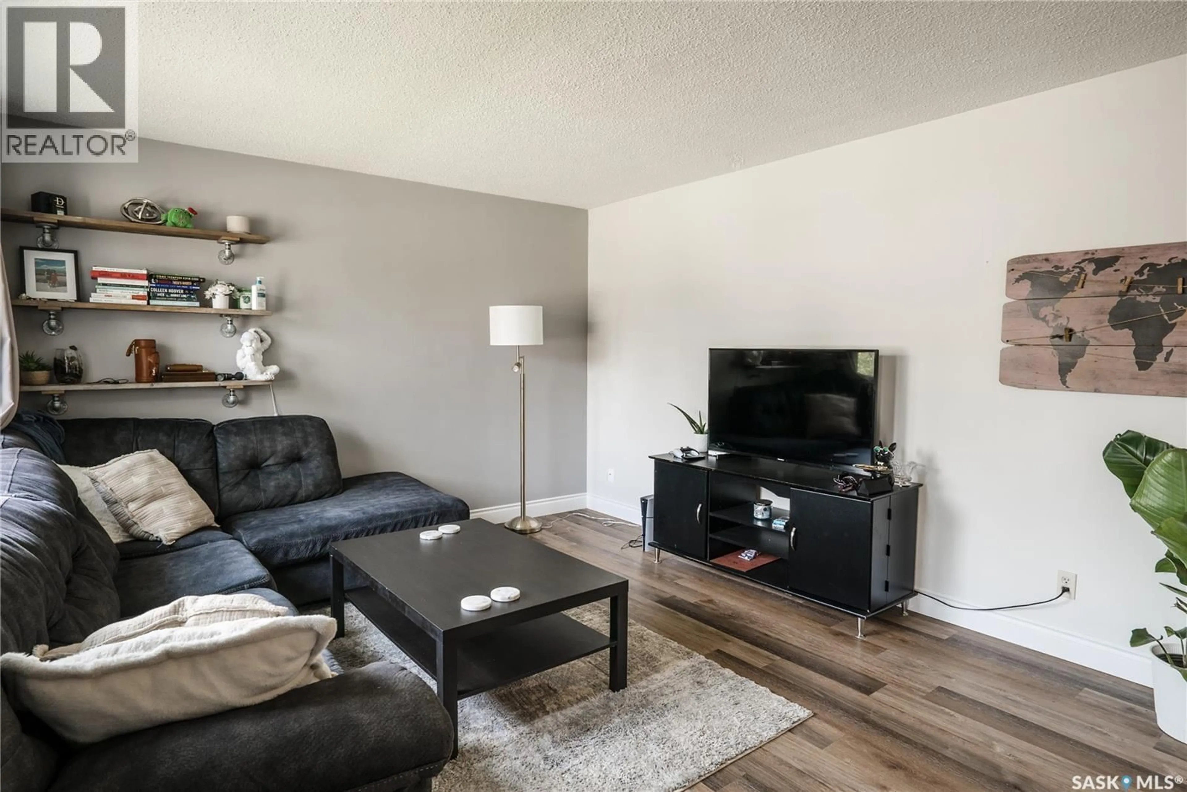 Living room with furniture, wood/laminate floor for 1134 2ND STREET, Saskatoon Saskatchewan S7H1R5