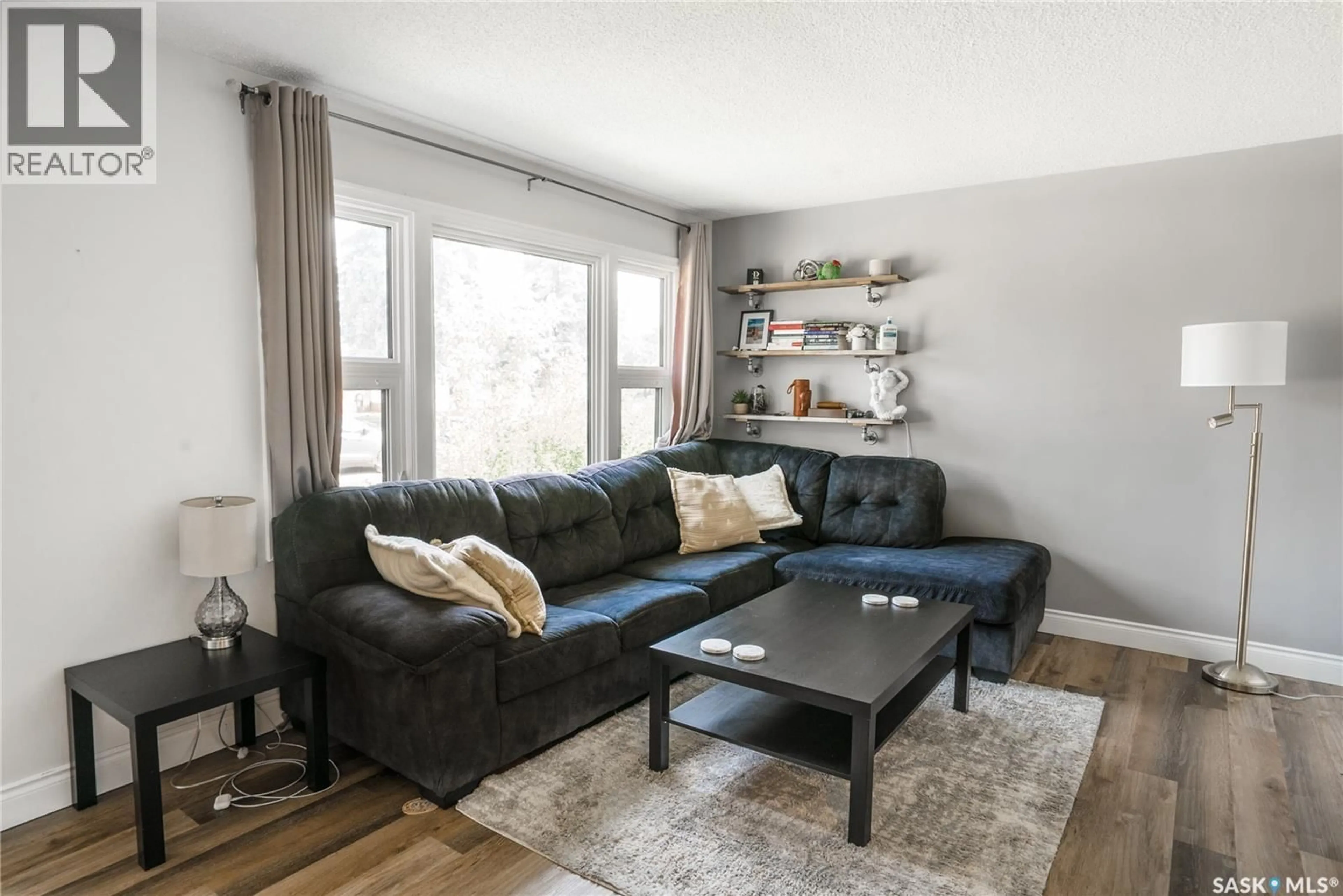 Living room with furniture, wood/laminate floor for 1134 2ND STREET, Saskatoon Saskatchewan S7H1R5