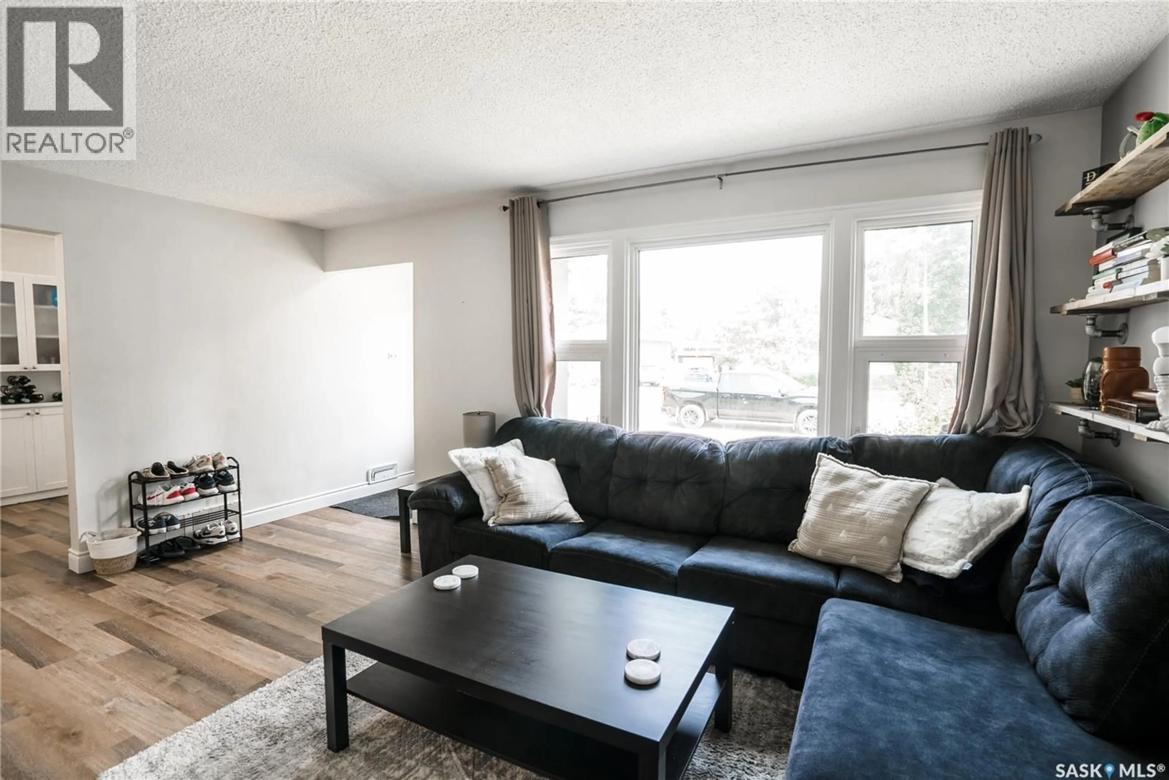 Living room with furniture, wood/laminate floor for 1134 2ND STREET, Saskatoon Saskatchewan S7H1R5