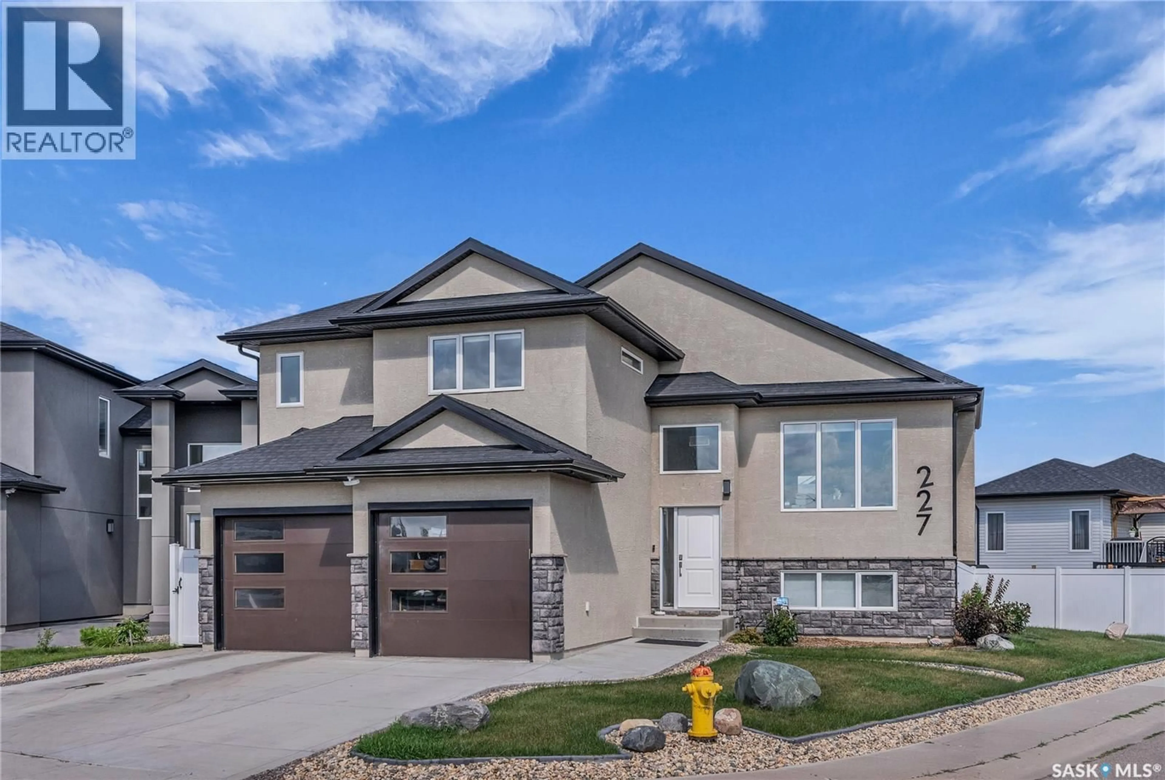 Home with vinyl exterior material, street for 227 BURGESS BAY, Saskatoon Saskatchewan S7V0S3