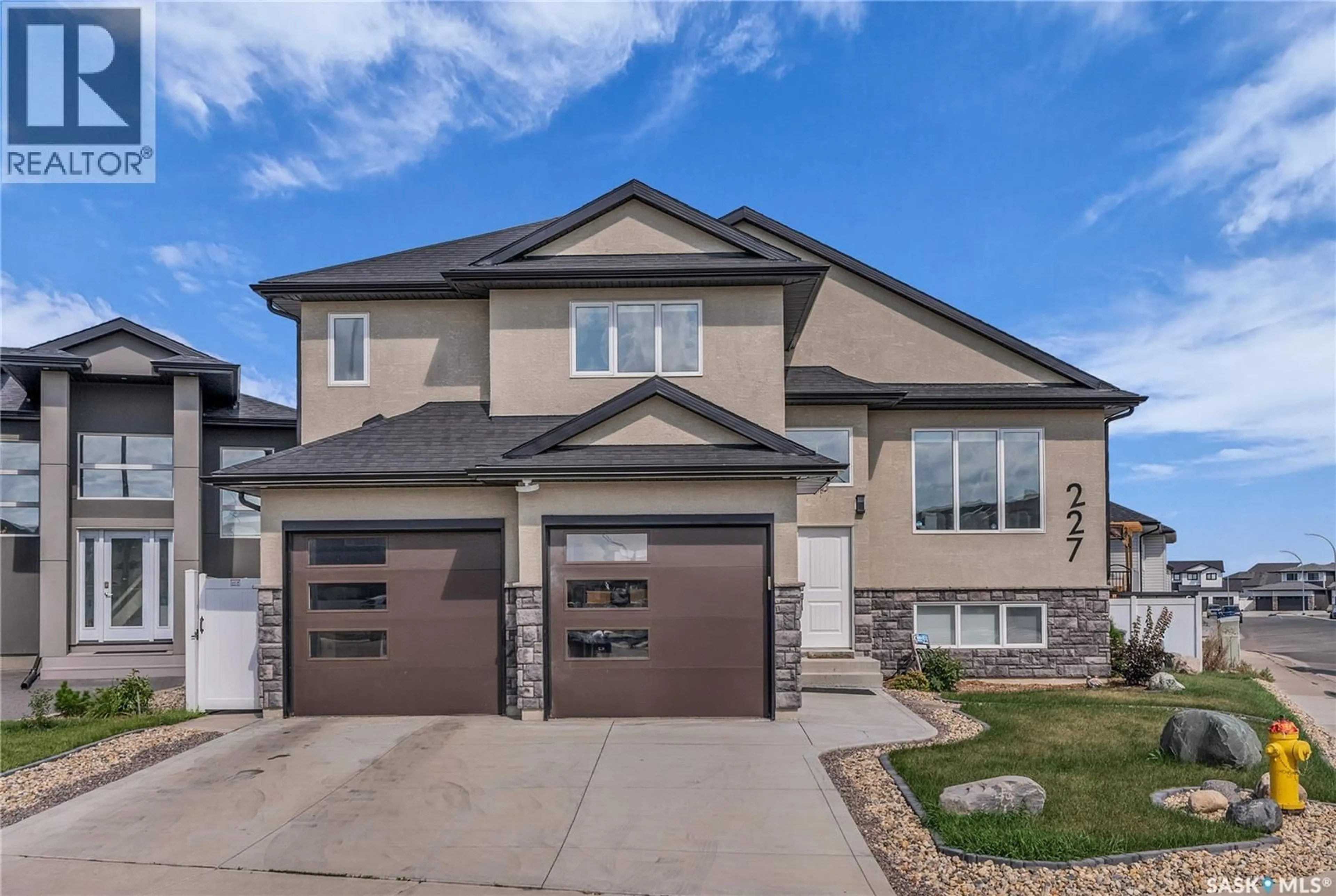 Home with brick exterior material, street for 227 BURGESS BAY, Saskatoon Saskatchewan S7V0S3