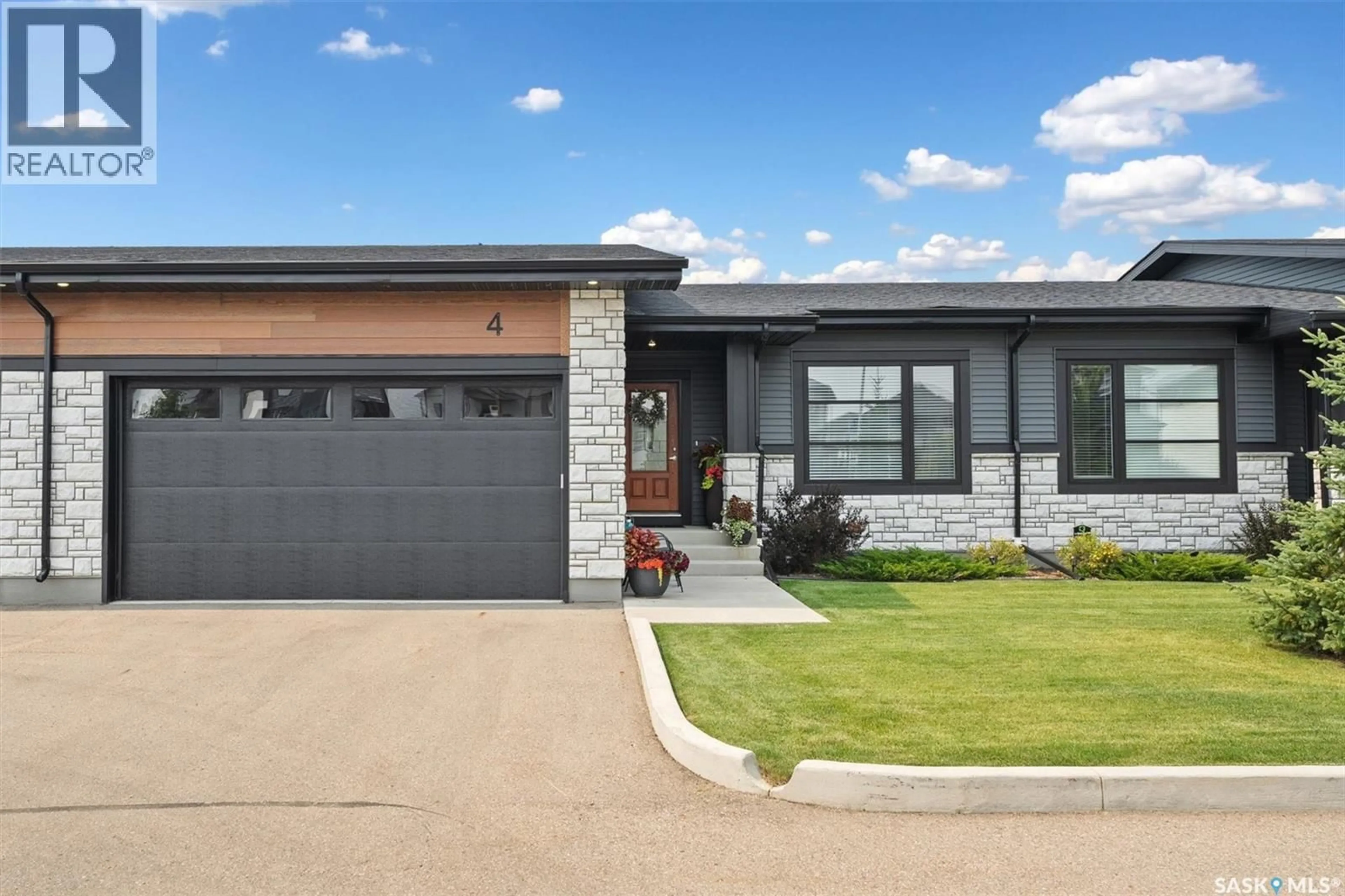 Home with brick exterior material, street for 4 - 310 EVERGREEN BOULEVARD, Saskatoon Saskatchewan S7W0Z1