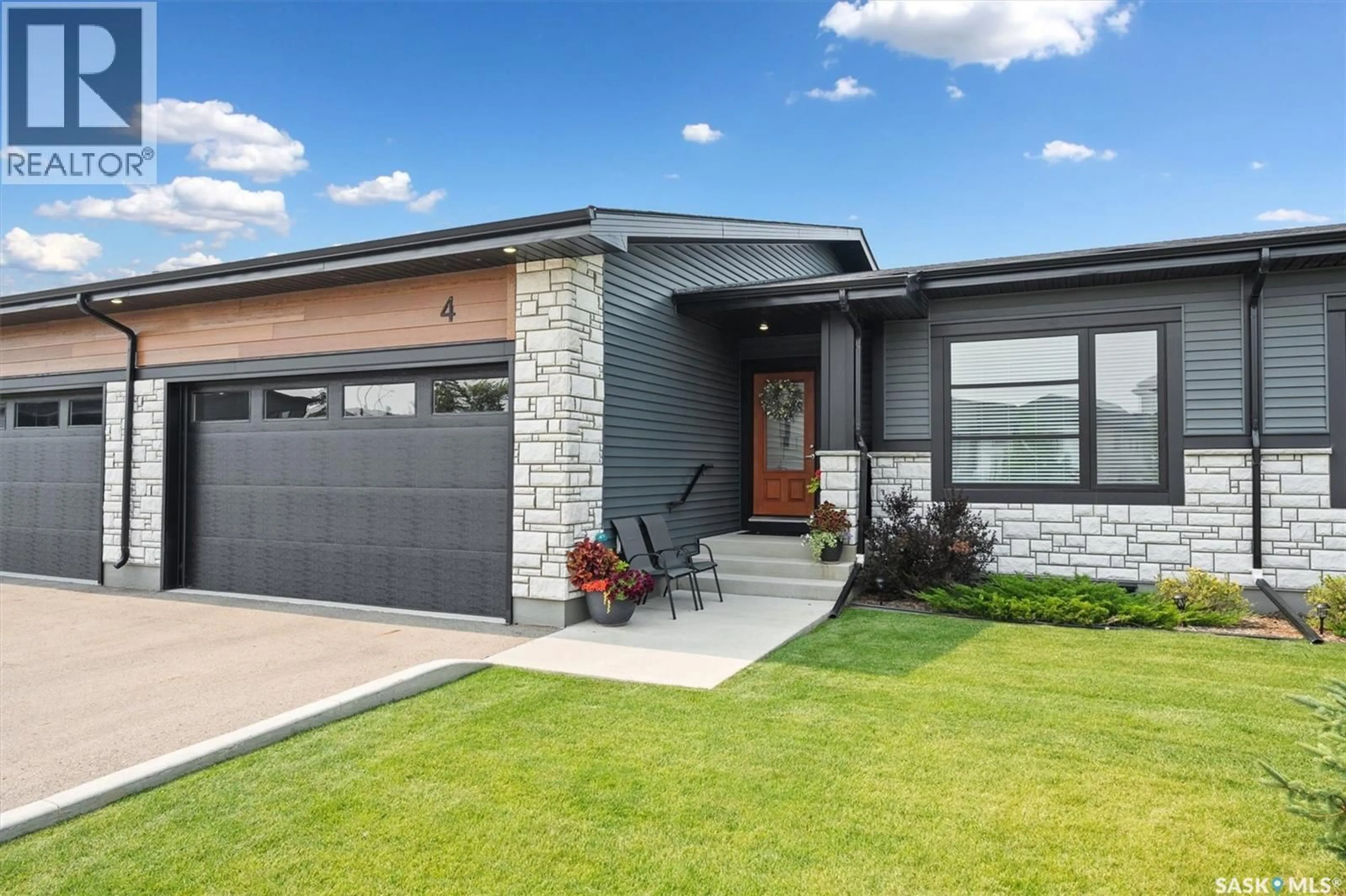 Home with brick exterior material, street for 4 - 310 EVERGREEN BOULEVARD, Saskatoon Saskatchewan S7W0Z1