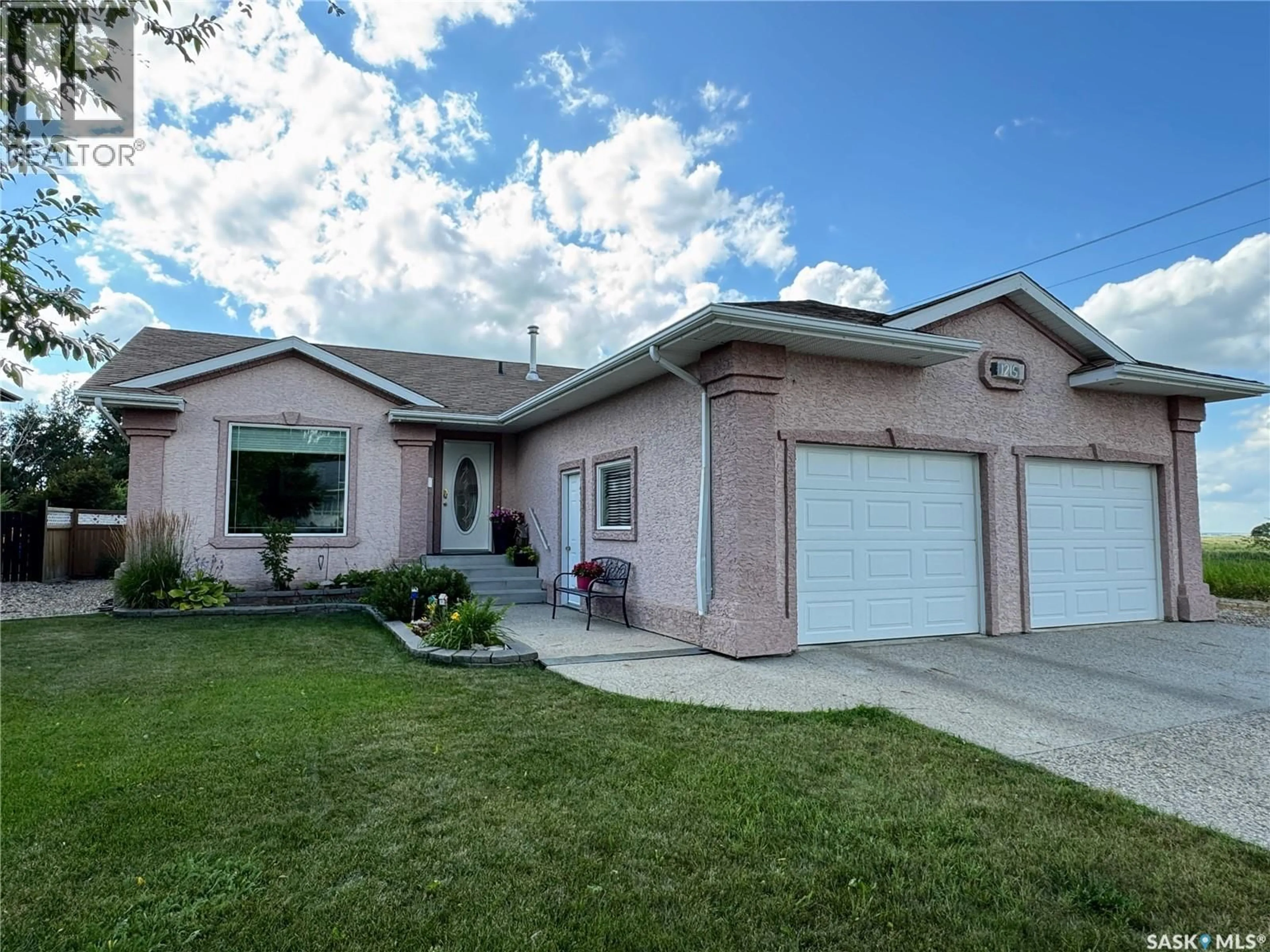 Home with vinyl exterior material, street for 1215 21ST STREET, Humboldt Saskatchewan S0K2A0