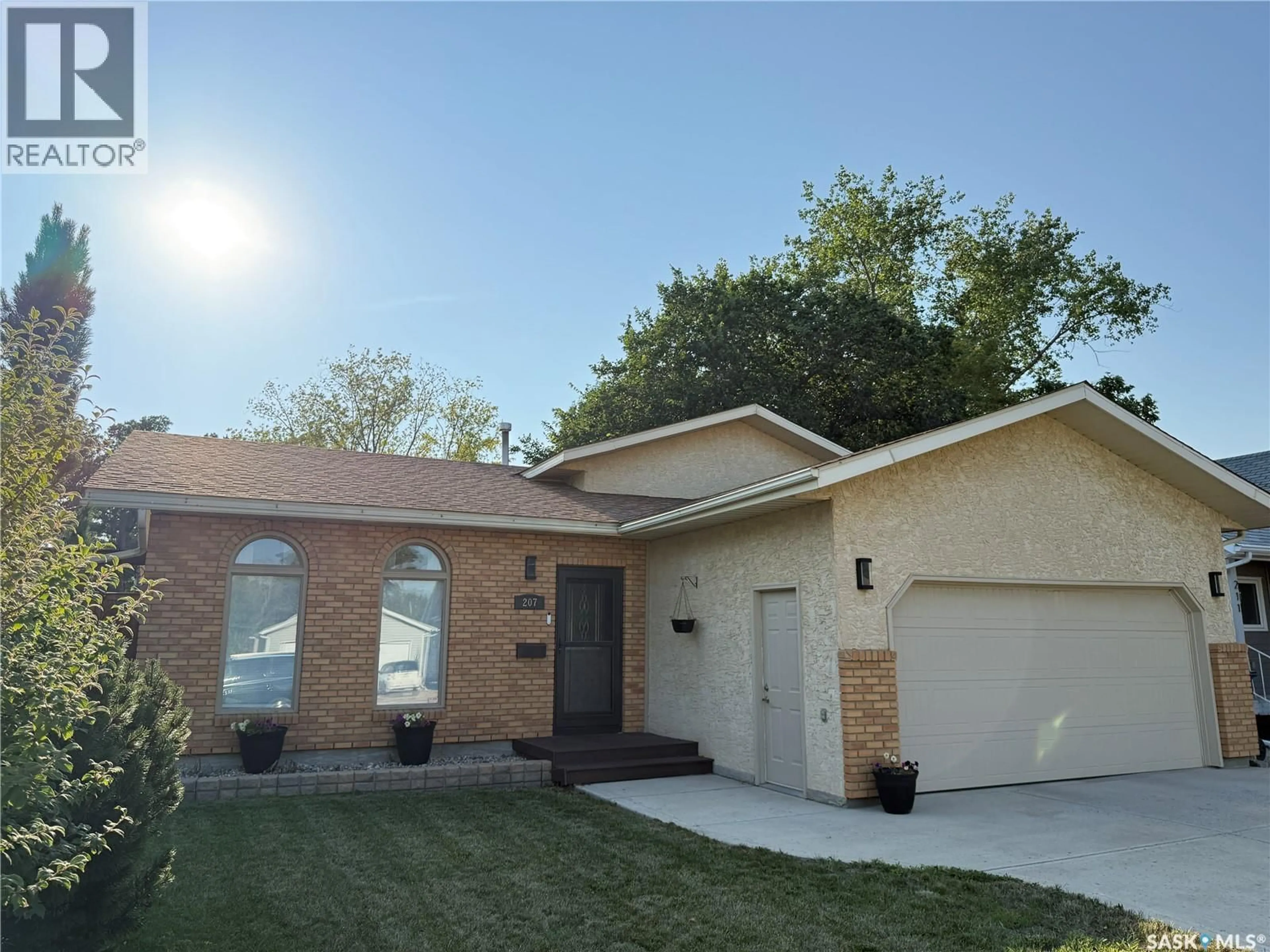 Home with brick exterior material, street for 207 9TH STREET, Weyburn Saskatchewan S4H1E9