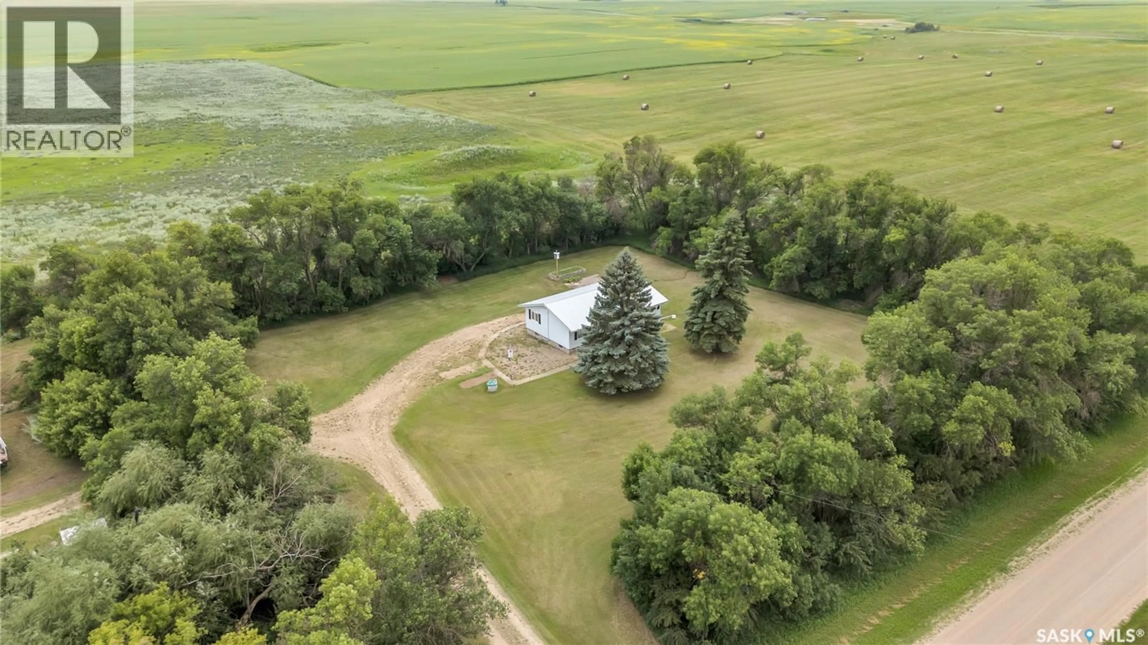 A pic from outside/outdoor area/front of a property/back of a property/a pic from drone, water/lake/river/ocean view for HAPPY SCHOOL ACREAGE, Lost River Rm No. 313 Saskatchewan S0K0C0