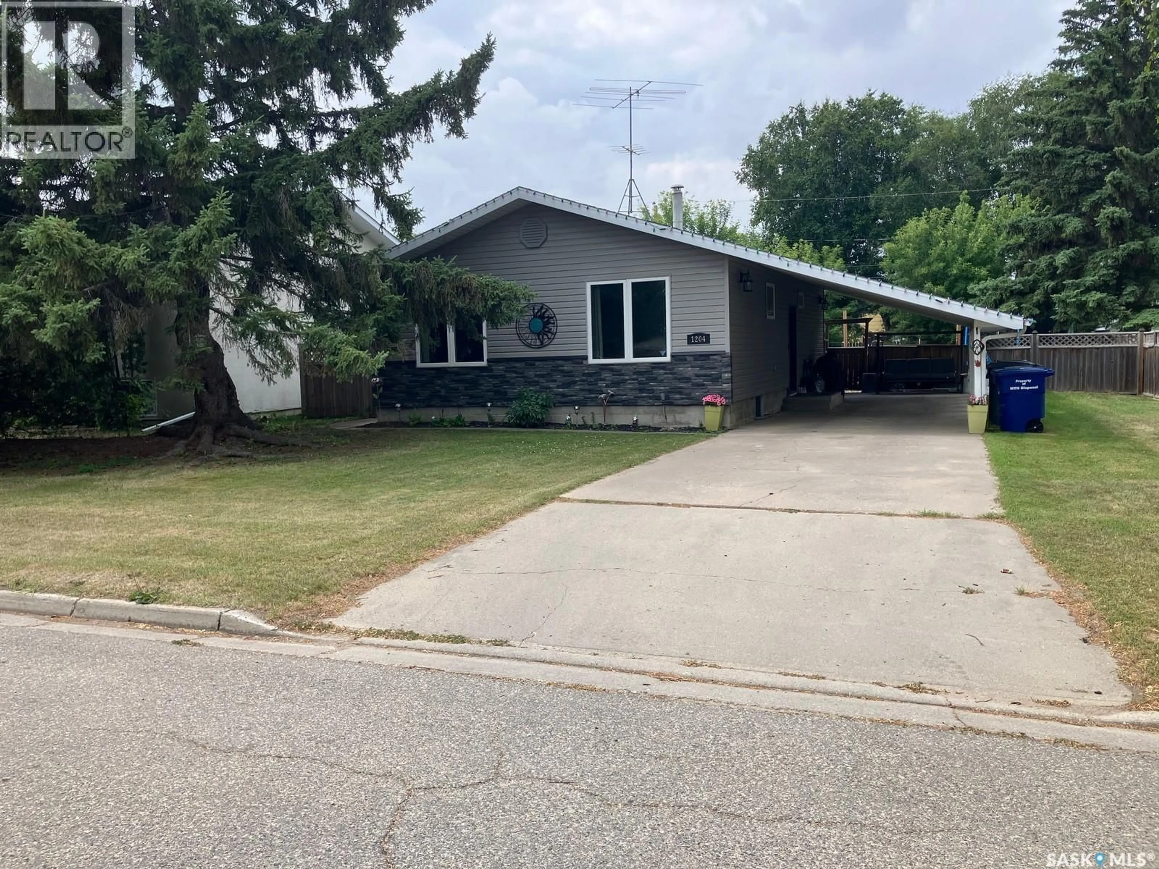 Home with vinyl exterior material, street for 1204 CENTRE STREET, Nipawin Saskatchewan S0E1E0