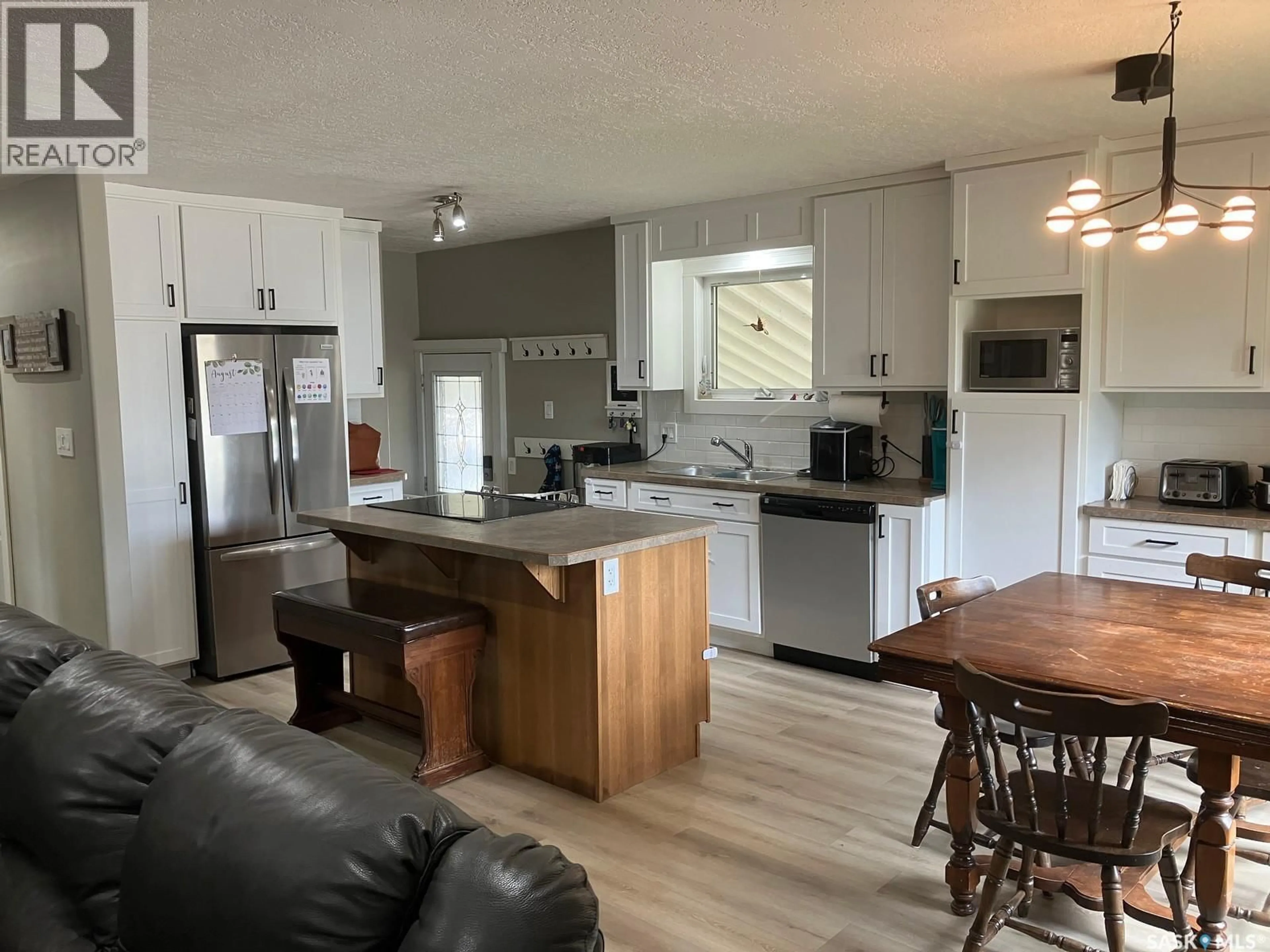 Open concept kitchen, wood/laminate floor for 1204 CENTRE STREET, Nipawin Saskatchewan S0E1E0