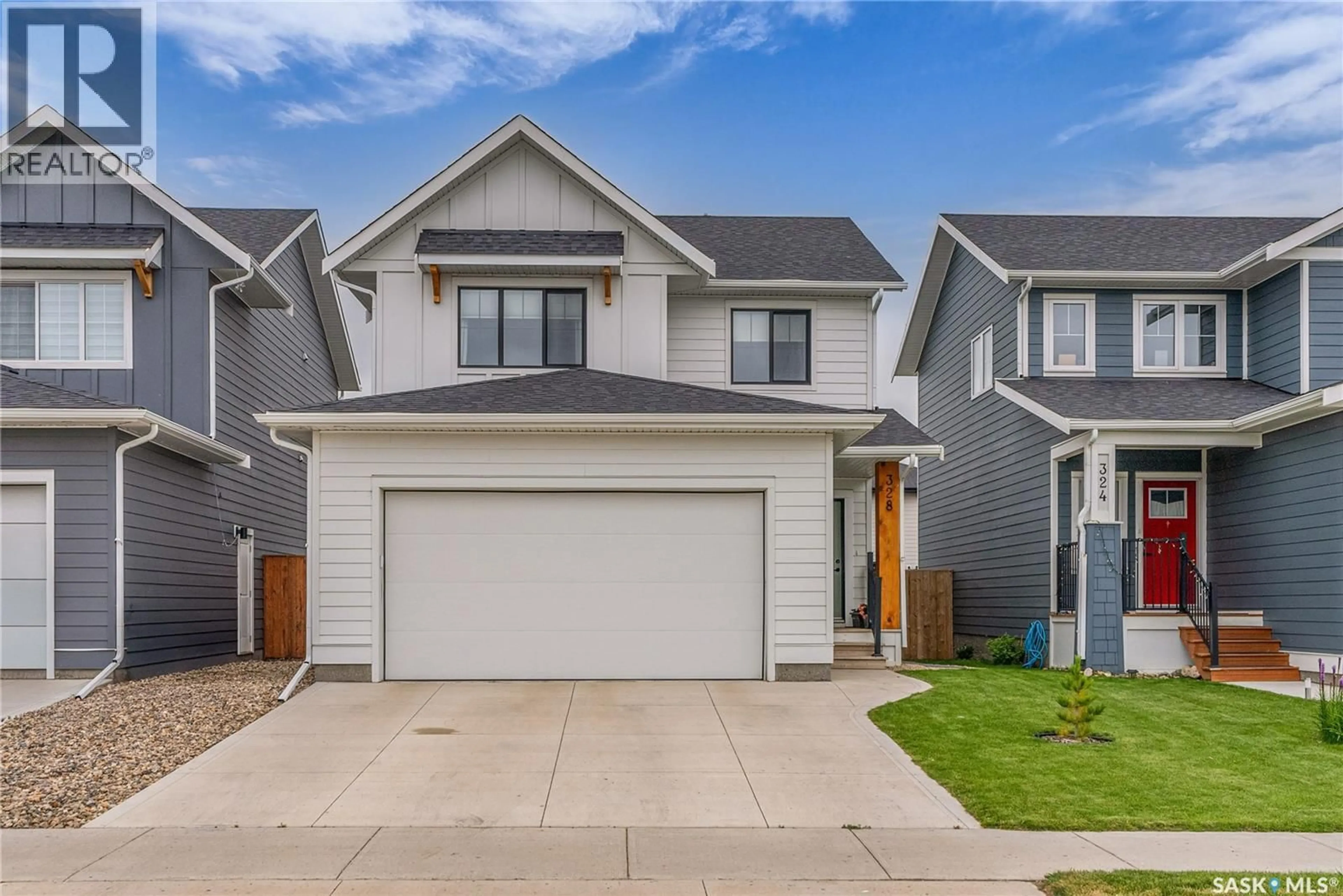 Home with vinyl exterior material, street for 328 OLSON LANE, Saskatoon Saskatchewan S7V0X6
