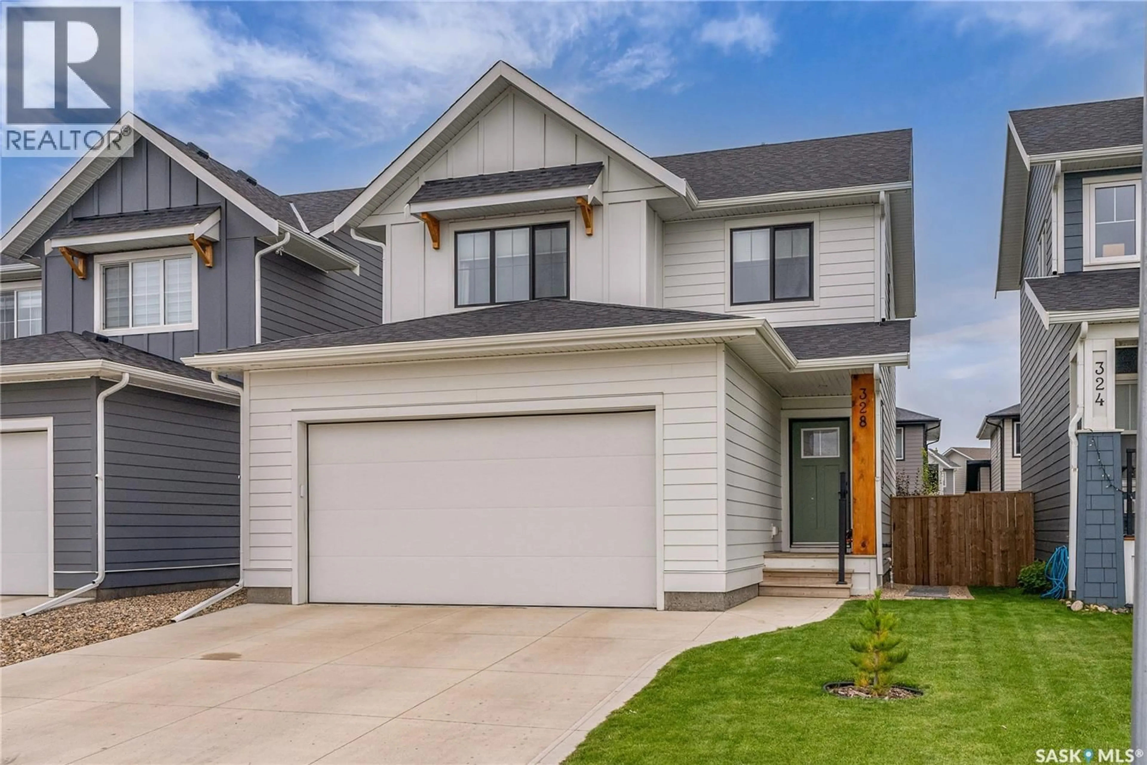 Home with vinyl exterior material, street for 328 OLSON LANE, Saskatoon Saskatchewan S7V0X6