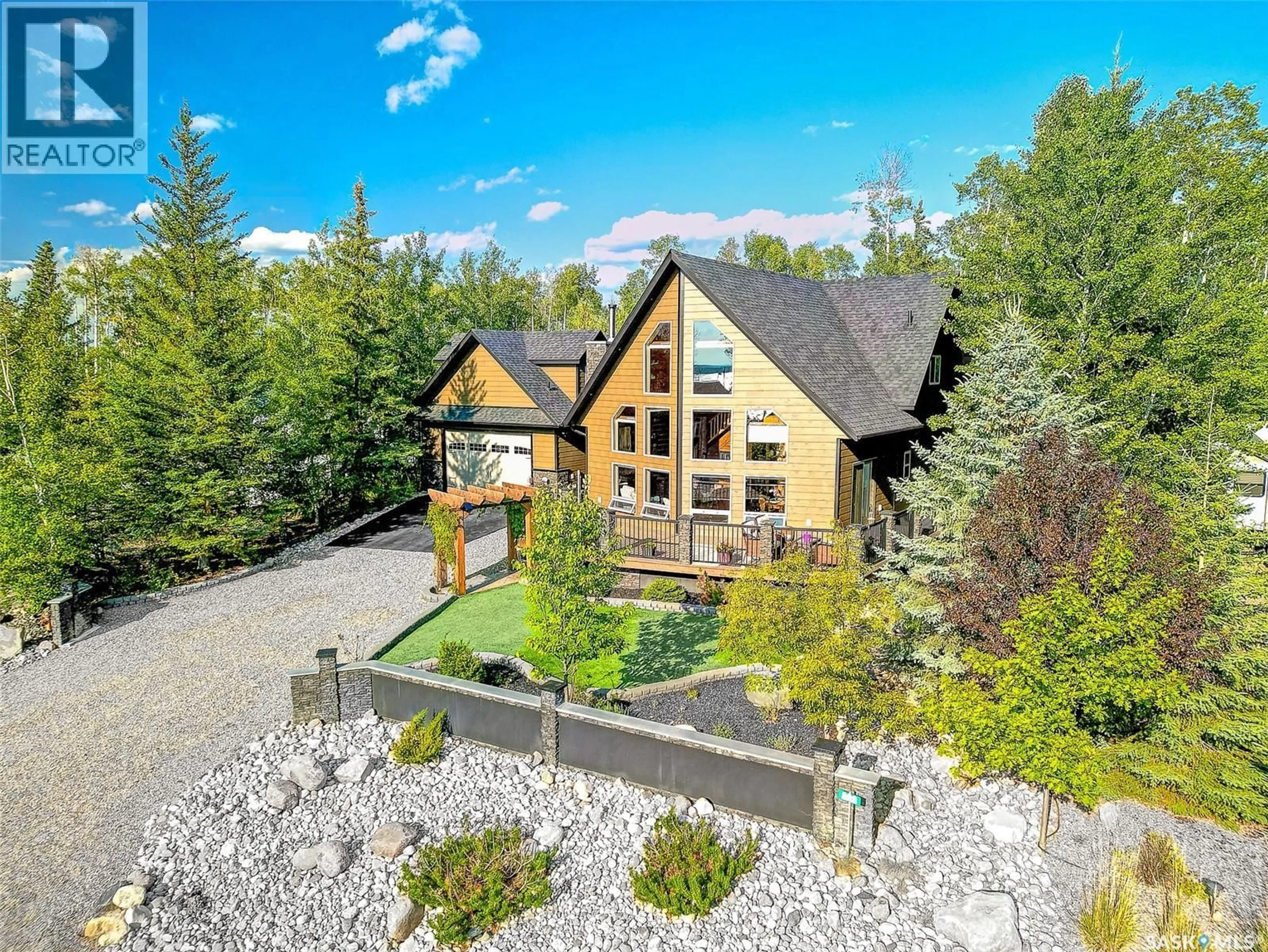 A pic from outside/outdoor area/front of a property/back of a property/a pic from drone, mountain view for 605 CEDAR CLOSE, Beaver River Rm No. 622 Saskatchewan S0M1A0